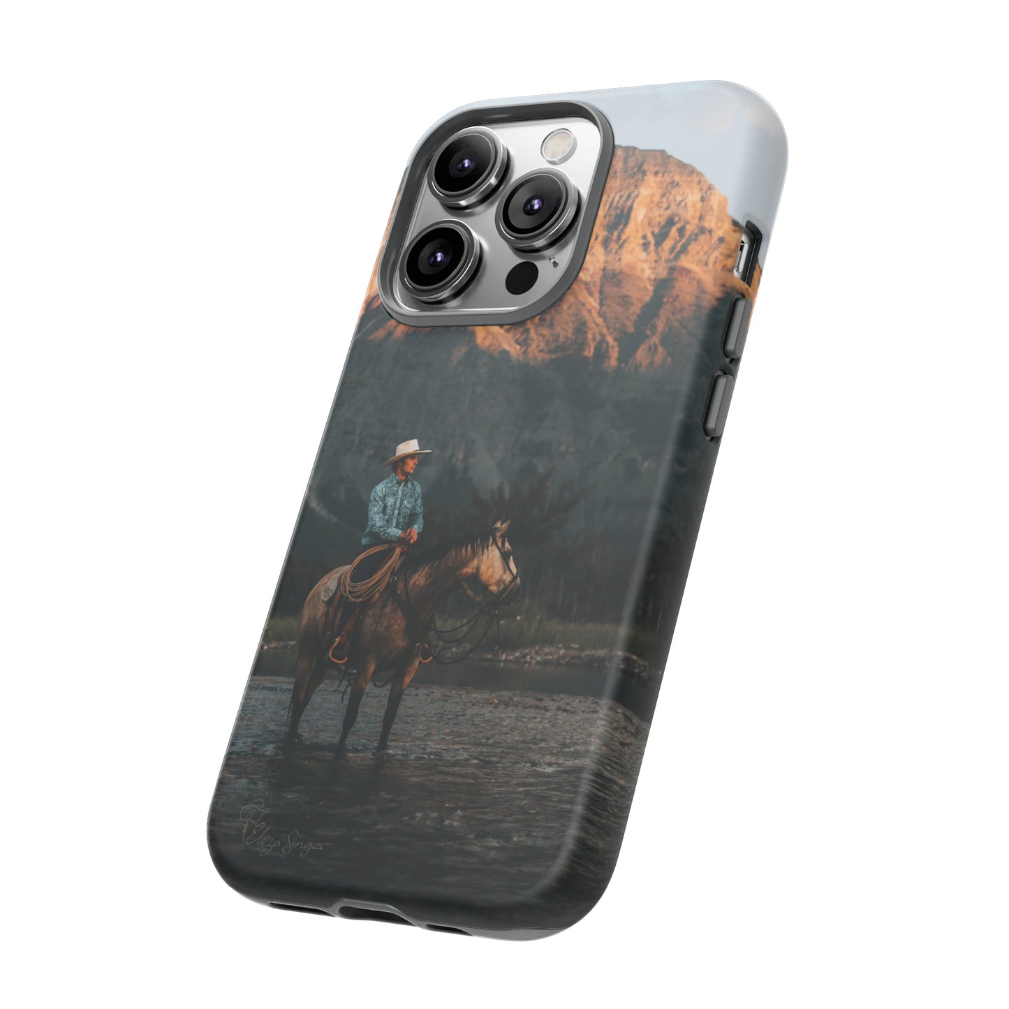 Capture the Wild: Horse Art Western Photo Yellowstone Design iPhone Tough Protective Cover. Featuring a Cowboy amidst Mountains and Buckskin hues, compatible with iPhone 15, 14, 13, XS, XR Pro/Max/Mini/P/Plus. Embrace the Spirit of the West with Style and Durability. #ElizaSinger #PhoneCase #WesternDesign
