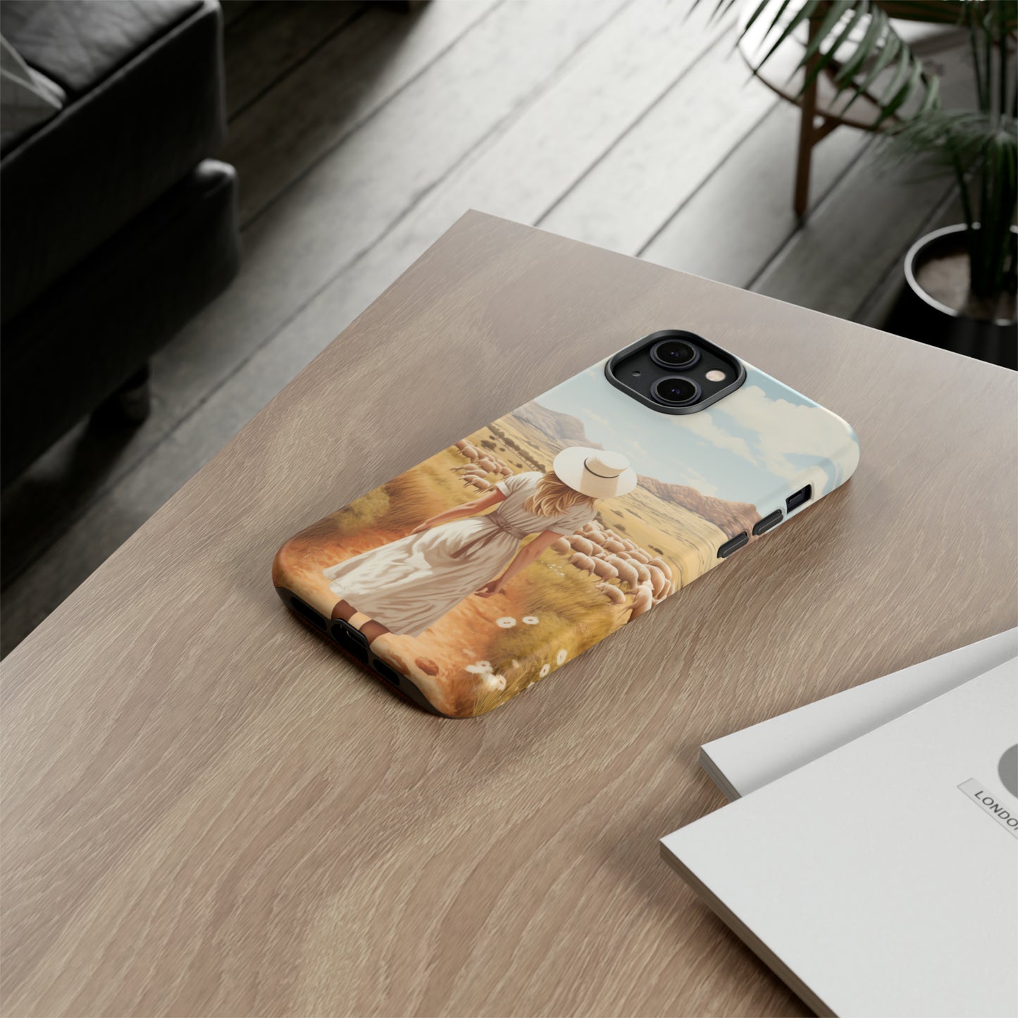 Dreamy Nostalgia: Immerse yourself in a vintage painted landscape with our Tough Western Cell Phone Case. Adorned with a woman in a hat strolling through a prairie with sheep, this edition captures the magic of the past. Elevate your phone with timeless charm. #ElizaSinger #PhoneCase