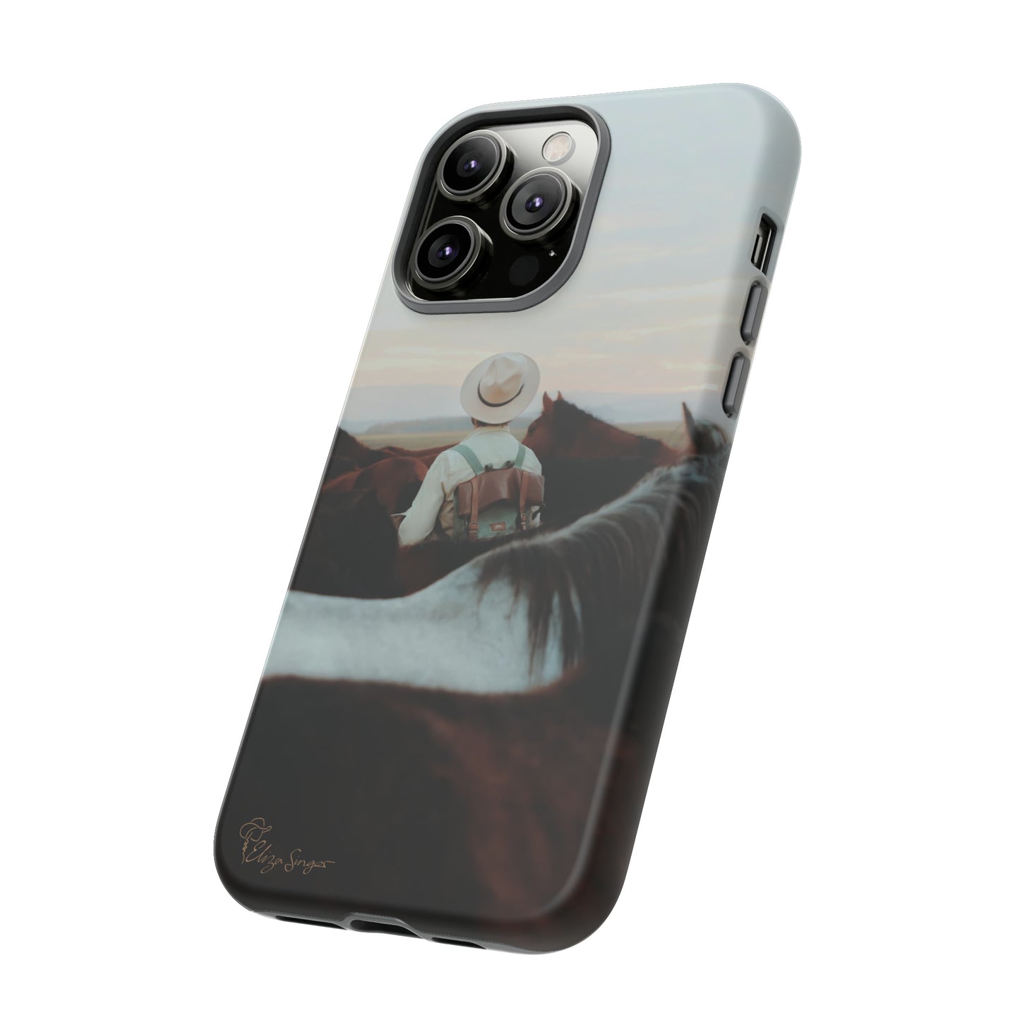 Ride into the Wild: Horse Art Western Photo Yellowstone Design iPhone Tough Protective Cover. Featuring a Cowboy amidst Mountains and Buckskin hues. Compatible with iPhone 15, 14, 13, XS, XR Pro/Max/Mini/P/Plus. Embrace the Spirit of the West with Style and Durability. #ElizaSinger #PhoneCase #WesternDesign