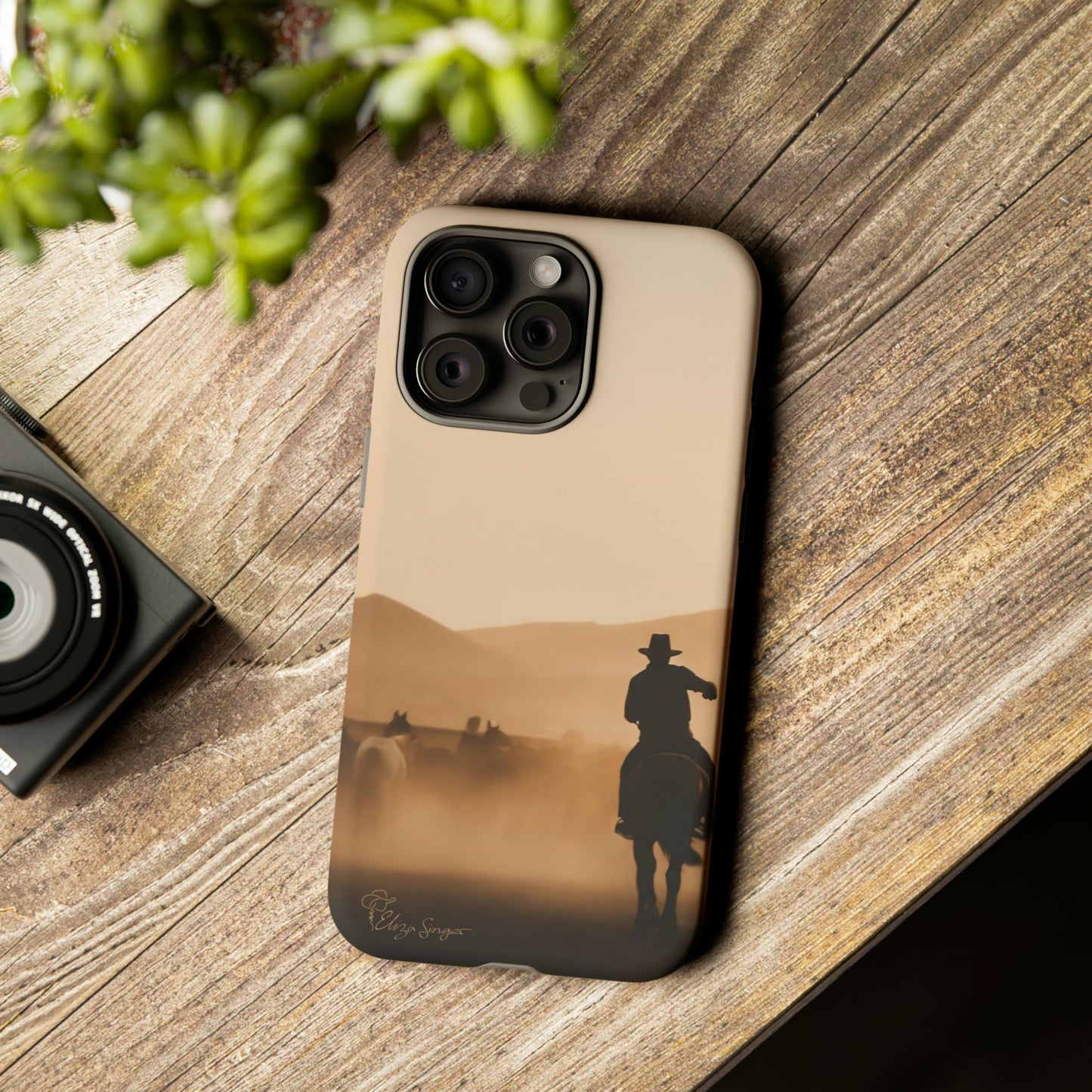 Capture the Western Spirit: Horse Art Western Photo Yellowstone Design iPhone Tough Protective Cover. Featuring a Cowboy amidst Mountains and Buckskin hues. Compatible with iPhone 15, 14, 13, XS, XR Pro/Max/Mini/P/Plus. Bring the Wild West to Your Device with Style and Durability. #ElizaSinger #PhoneCase #WesternDesign
