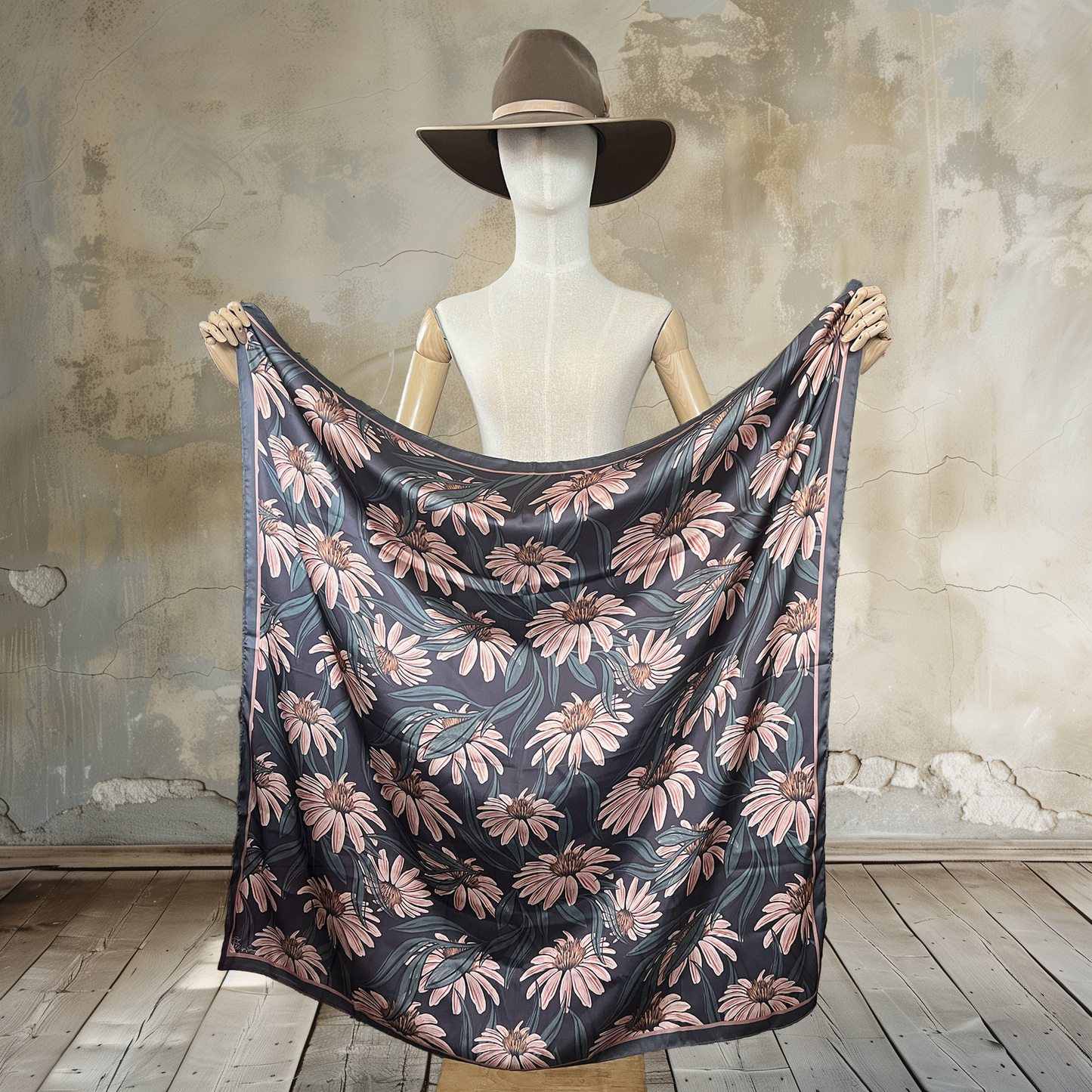 Embrace bohemian chic with our Boho Meadows Wild Rag. Muted shades of brown form intricate daisy patterns on this 39" square of
100% satin silk. Elevate your style with this free-spirited and versatile accessory.