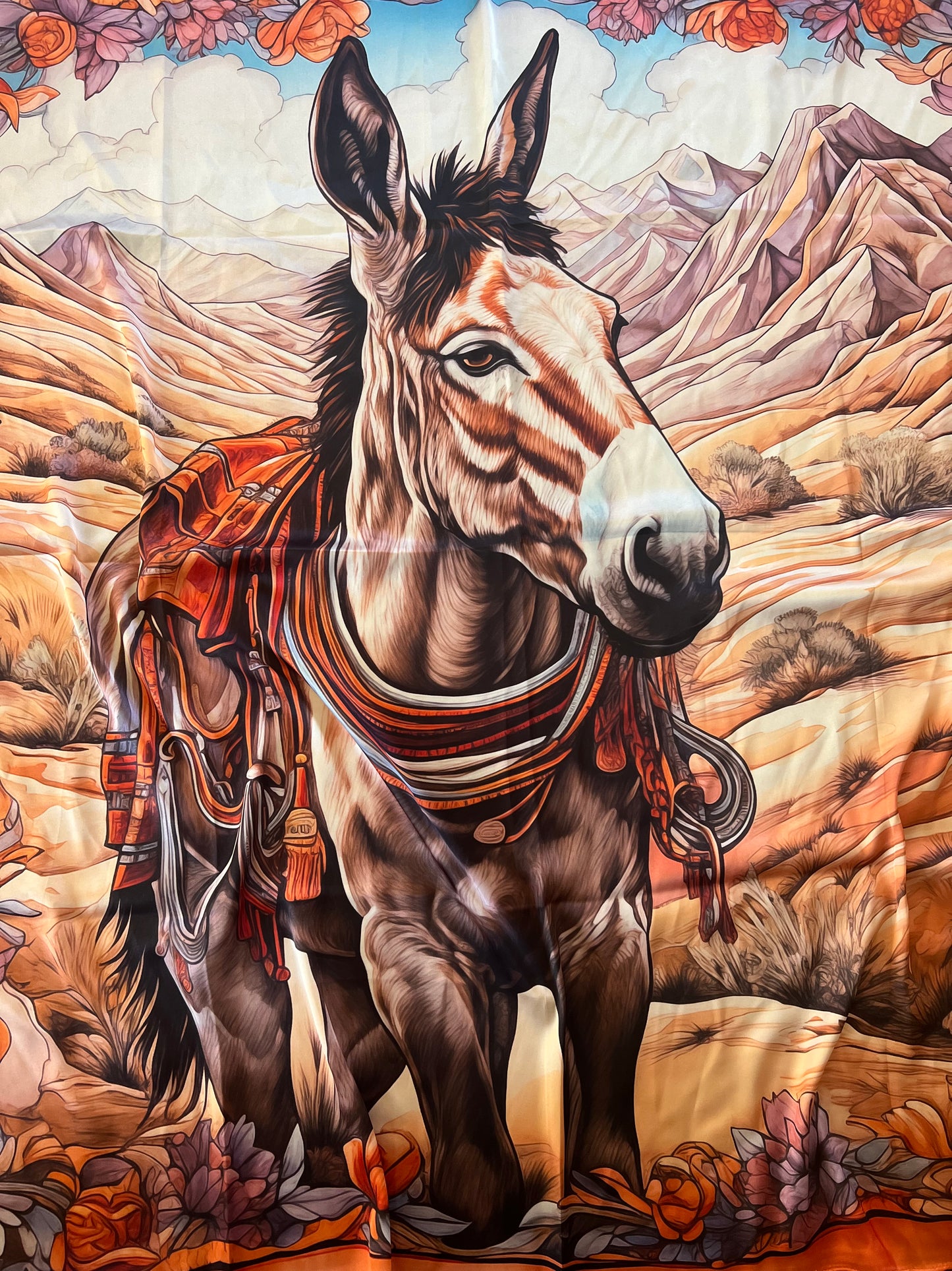 celebrate desert beauty with this mule wild rag by Eliza Singer. Framed in florals with warm earthy tones, printed on satin silk and signed by the artist.