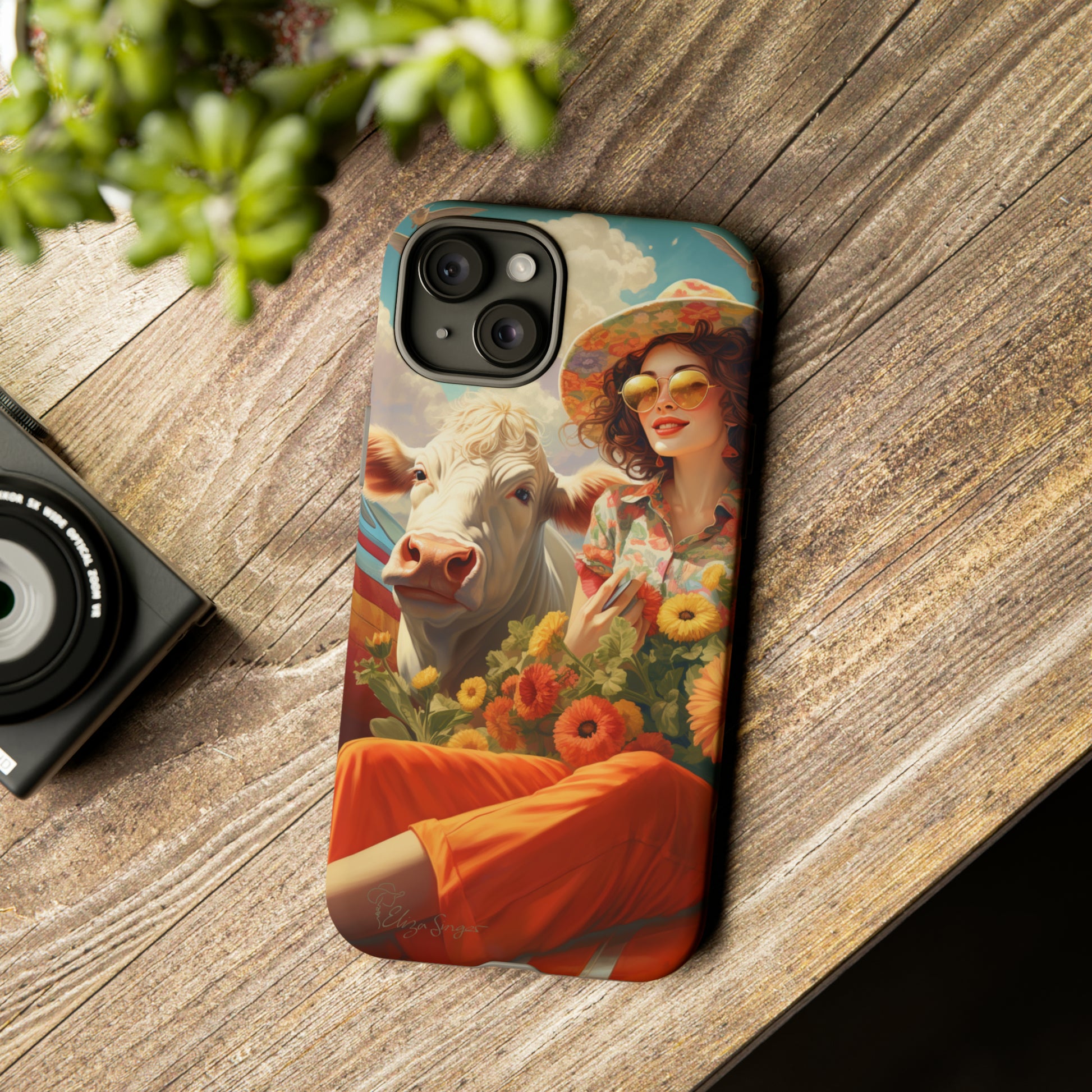 Timeless Retro Charm: Step back in time with our Tough Western Cell Phone Case. Featuring a vintage and bright design, a woman in a hat with daisies is accompanied by a cow looking over her shoulder. Experience the perfect blend of retro aesthetics and durability. Elevate your style with a touch of nostalgia. #ElizaSinger #PhoneCase #RetroStyle 