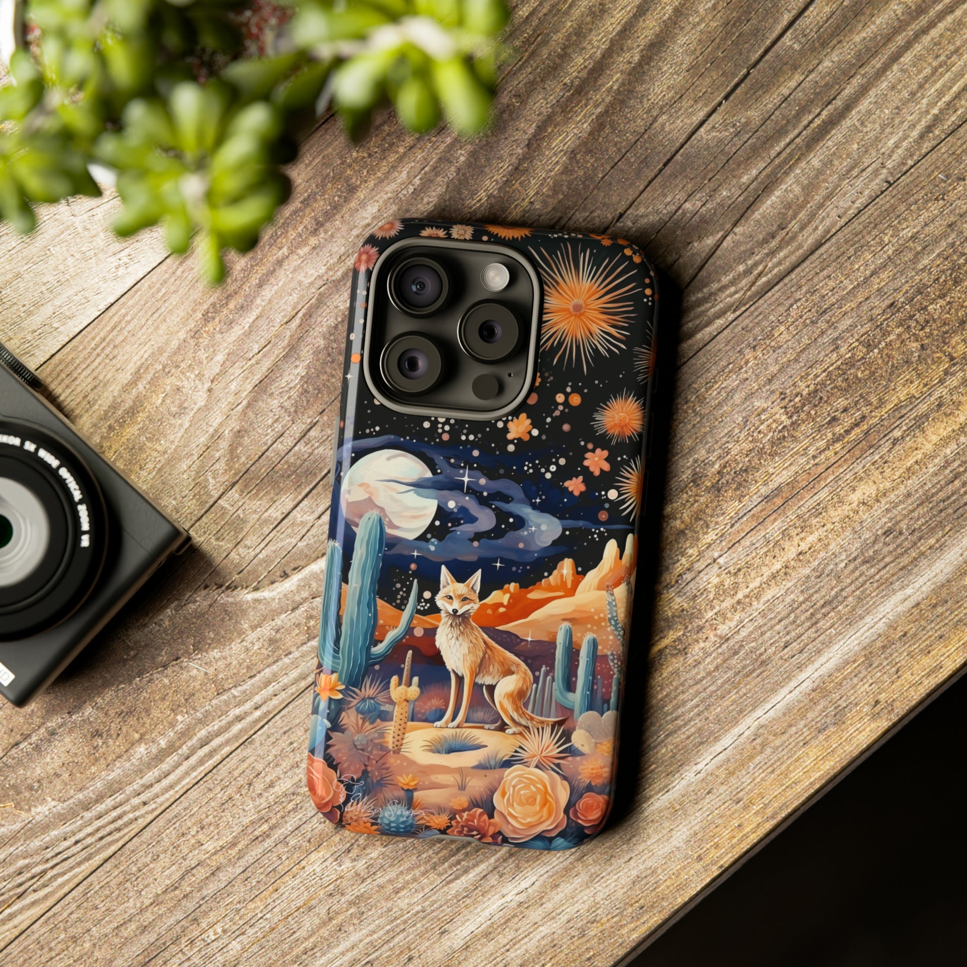 Introducing our Tough Western Cell Phone Case: Midnight Mirage Jackal Edition! Dive into the mysterious desert night with a striking depiction of a jackal, cacti, and a starry sky. This design offers the ideal combination of durability and desert charm.