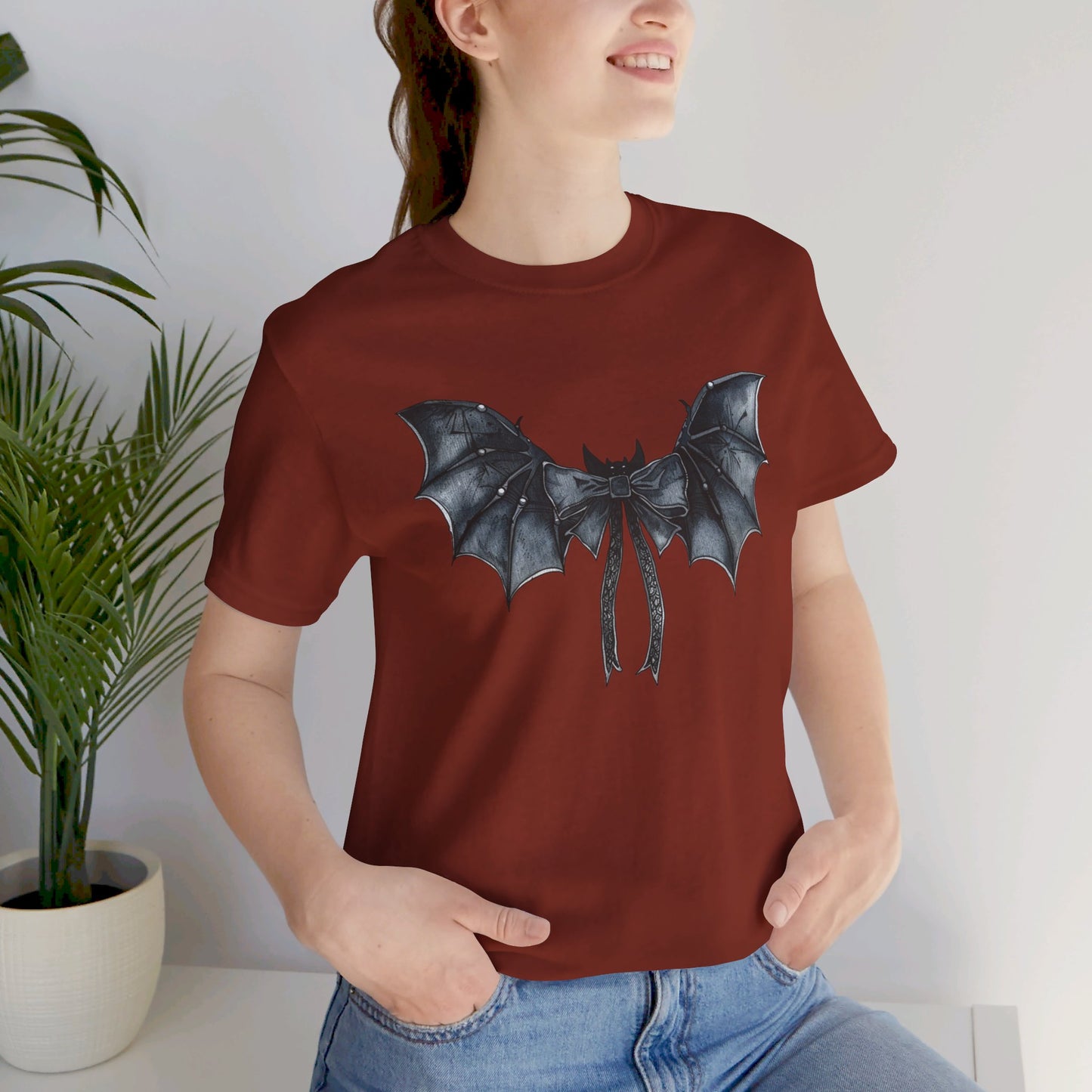 Subtle Spooks: Halloween Bella Canvas T-shirt with Minimalistic Bat Wing Design
