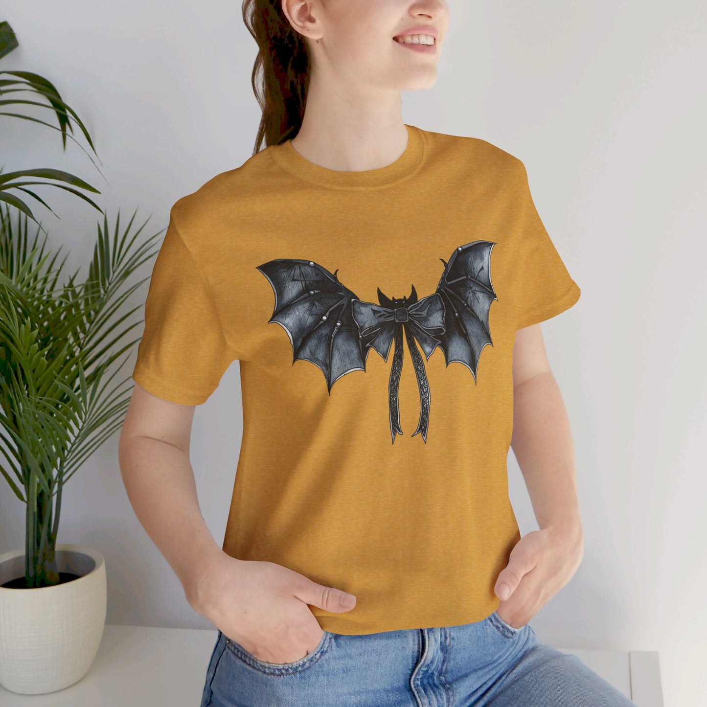 Subtle Spooks: Halloween Bella Canvas T-shirt with Minimalistic Bat Wing Design