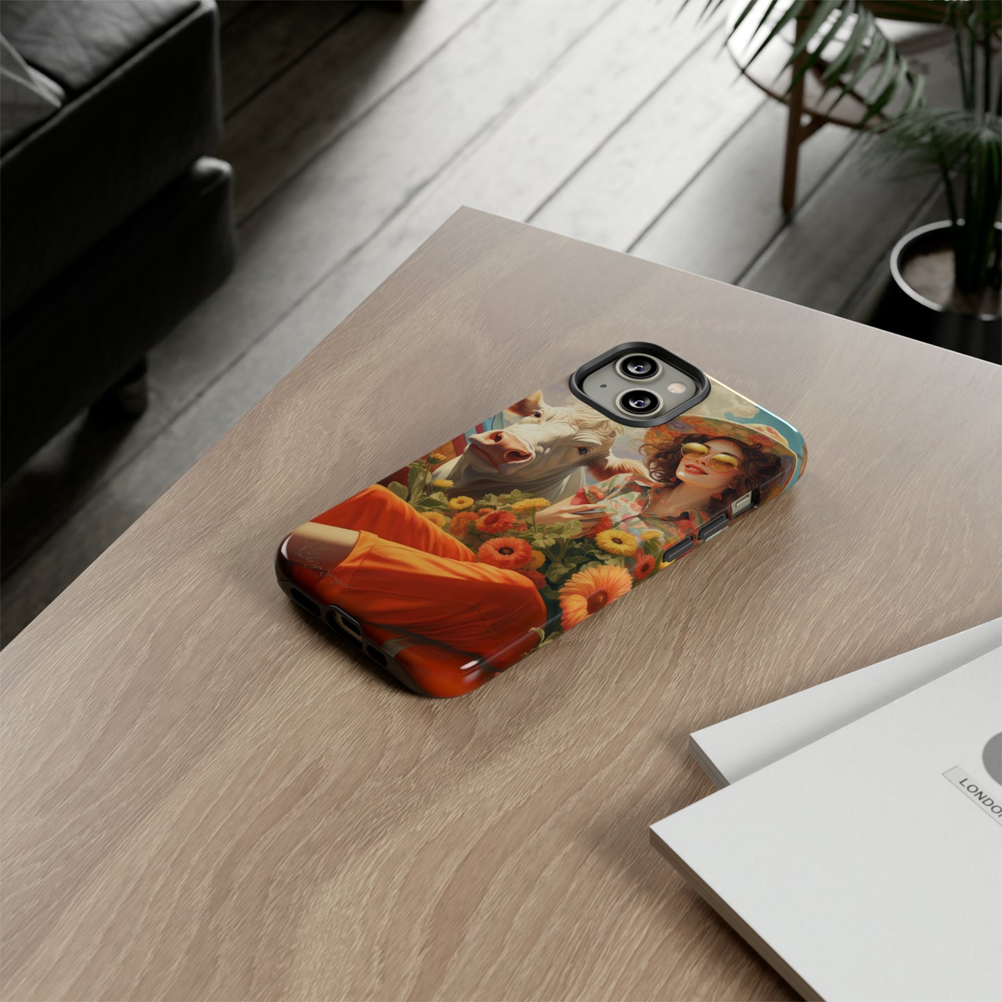 Timeless Retro Charm: Step back in time with our Tough Western Cell Phone Case. Featuring a vintage and bright design, a woman in a hat with daisies is accompanied by a cow looking over her shoulder. Experience the perfect blend of retro aesthetics and durability. Elevate your style with a touch of nostalgia. #ElizaSinger #PhoneCase #RetroStyle 