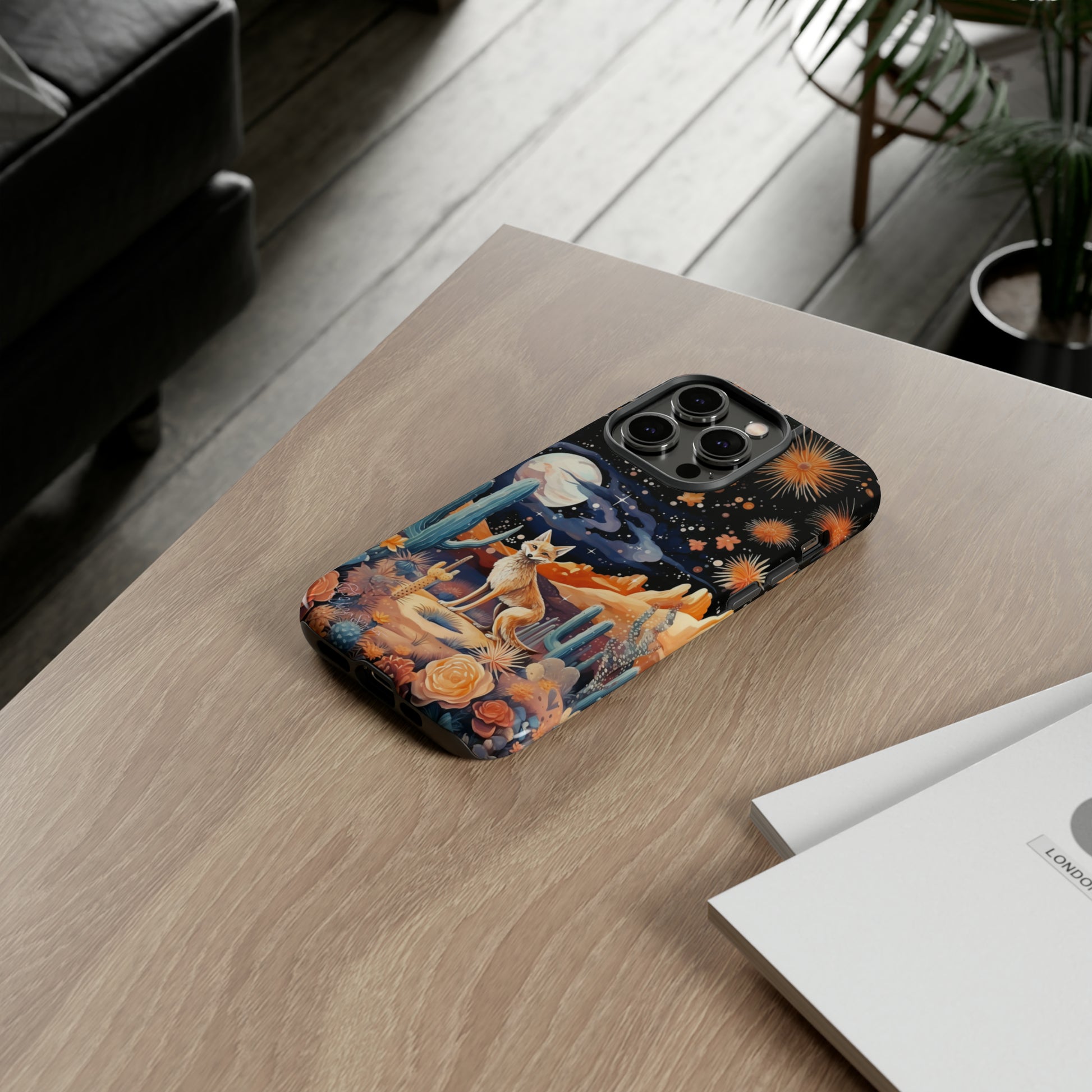 Introducing our Tough Western Cell Phone Case: Midnight Mirage Jackal Edition! Dive into the mysterious desert night with a striking depiction of a jackal, cacti, and a starry sky. This design offers the ideal combination of durability and desert charm.