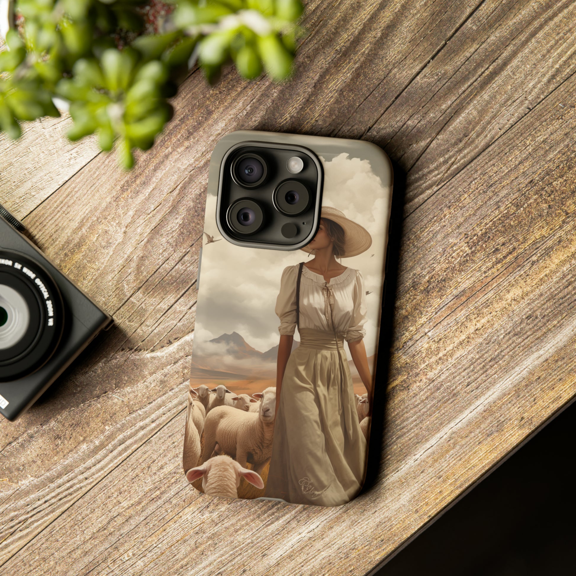 Immerse yourself in a dreamy landscape with our Tough Western Cell Phone Case showcasing a vintage painted design of a woman wearing a hat, walking through a prairie landscape with sheep behind her. Experience the magic of the past with this edition.