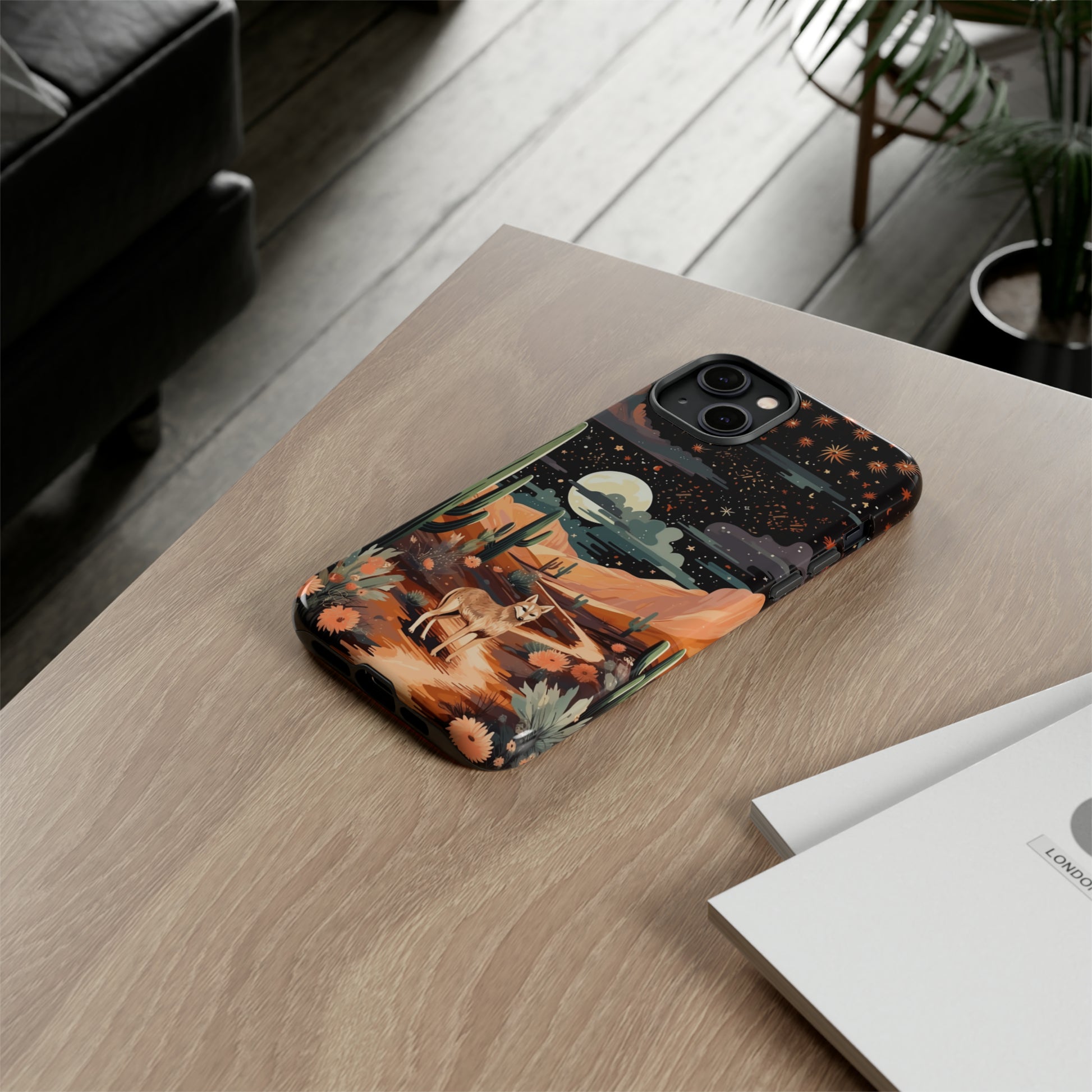 Introducing our Tough Western Cell Phone Case: Twilight Desert Jackal Remix Edition! A variation of our popular design, this edition features a jackal in a desert landscape with a starry night sky and cacti. Get ready for a unique twist on classic rugged protection.