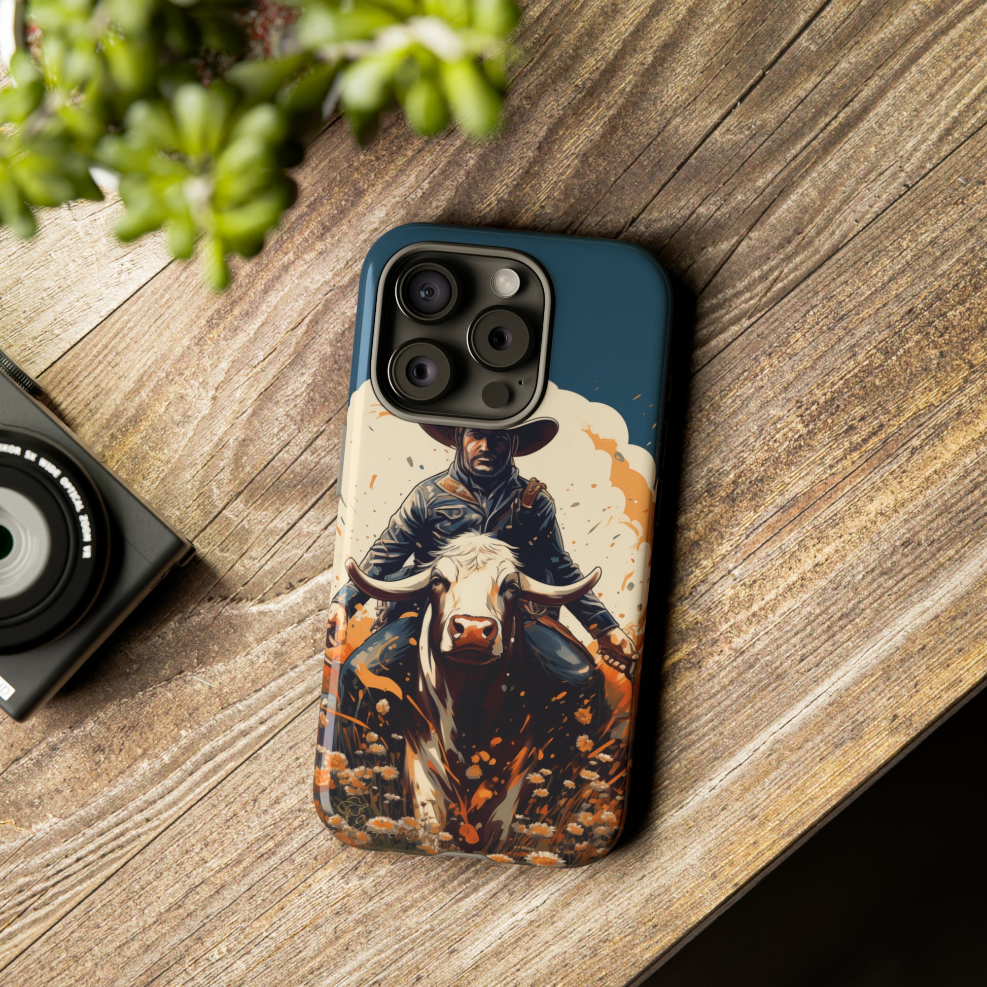 Time-Tested Charm: Immerse yourself in the charm of yesteryear with our Tough Cell Phone Case. Featuring a cowboy on a cow in a field of flowers, this design exudes retro vibes. Experience the perfect blend of vintage style and durable protection. Elevate your phone with a touch of timeless allure. #ElizaSinger #PhoneCase #VintageCharm