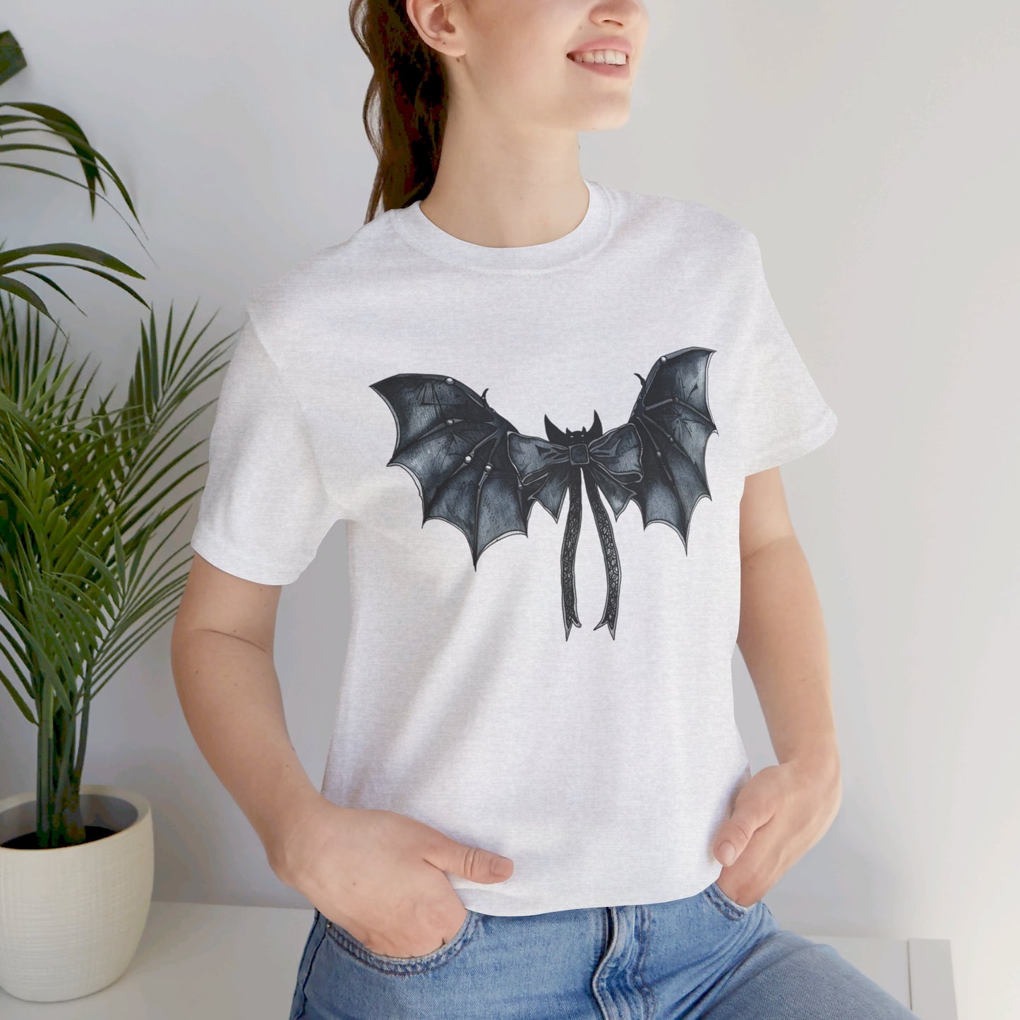 Subtle Spooks: Halloween Bella Canvas T-shirt with Minimalistic Bat Wing Design
