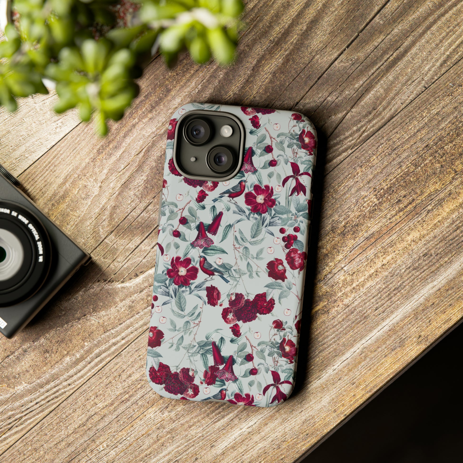 Cherry Blossom Serenade: Cherish nature's beauty with 'Cherry Blossom Serenade.' This iPhone case features flowers and burgundy birds on a blue background, creating a captivating floral wildlife bird and flower design. Elevate your device with this enchanting and stylish protective cover. #ElizaSinger #PhoneCase #FloralDesign
