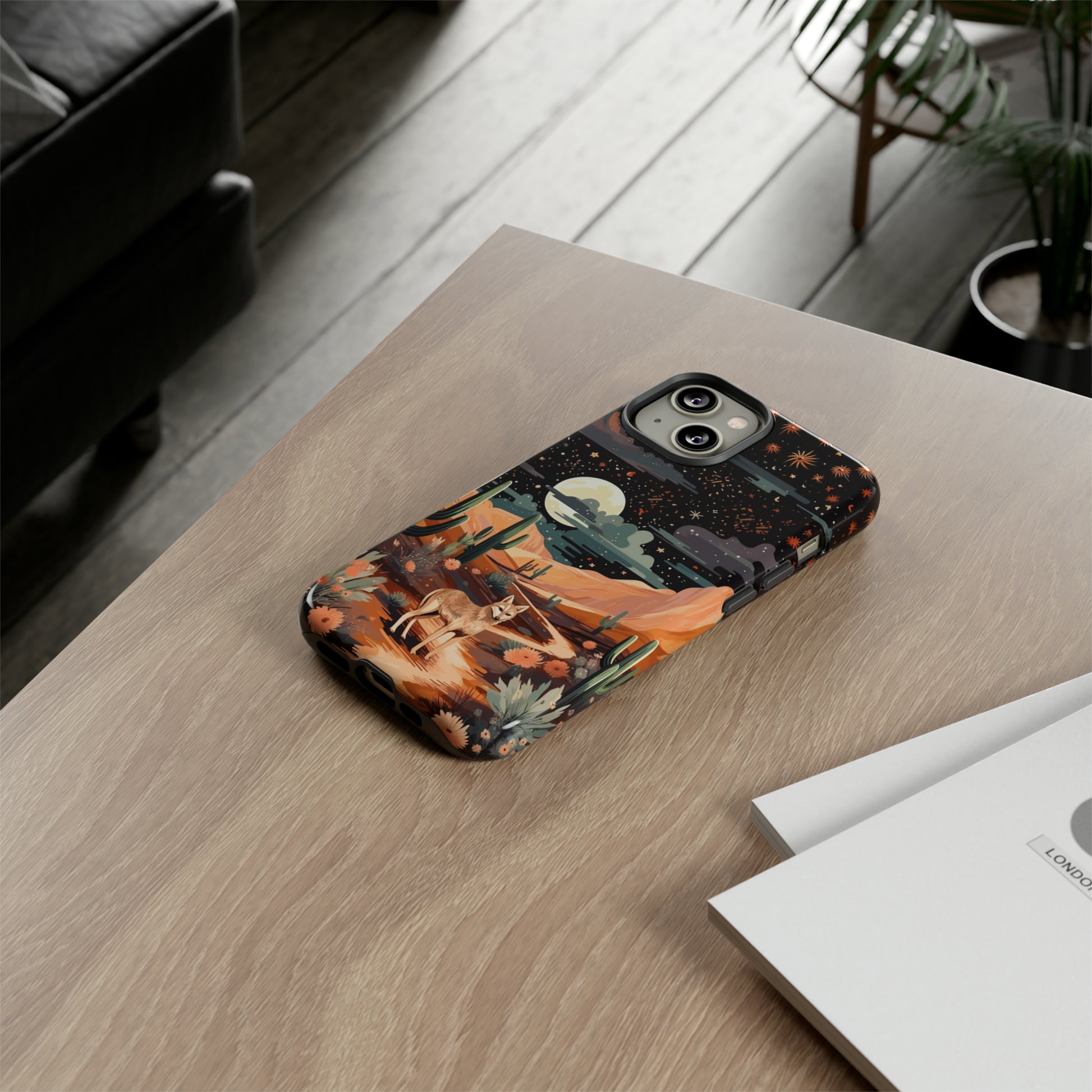 Unveiling our Tough Western Cell Phone Case: Stellar Desert Jackal Edition! Embrace the beauty of the night with a jackal in a desert landscape, under a starry sky, surrounded by cacti. This case provides rugged protection with a touch of celestial elegance.