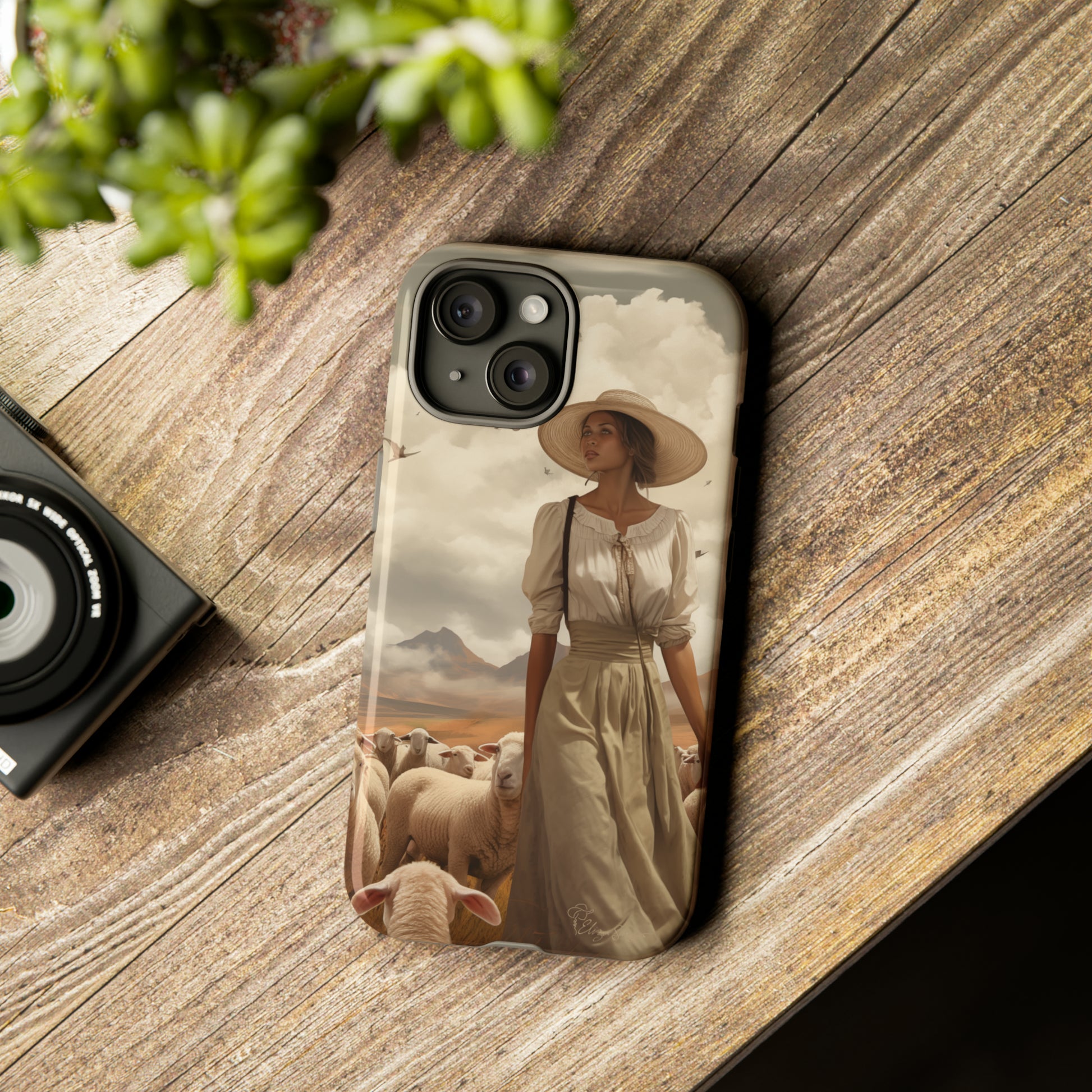 Immerse yourself in a dreamy landscape with our Tough Western Cell Phone Case showcasing a vintage painted design of a woman wearing a hat, walking through a prairie landscape with sheep behind her. Experience the magic of the past with this edition.