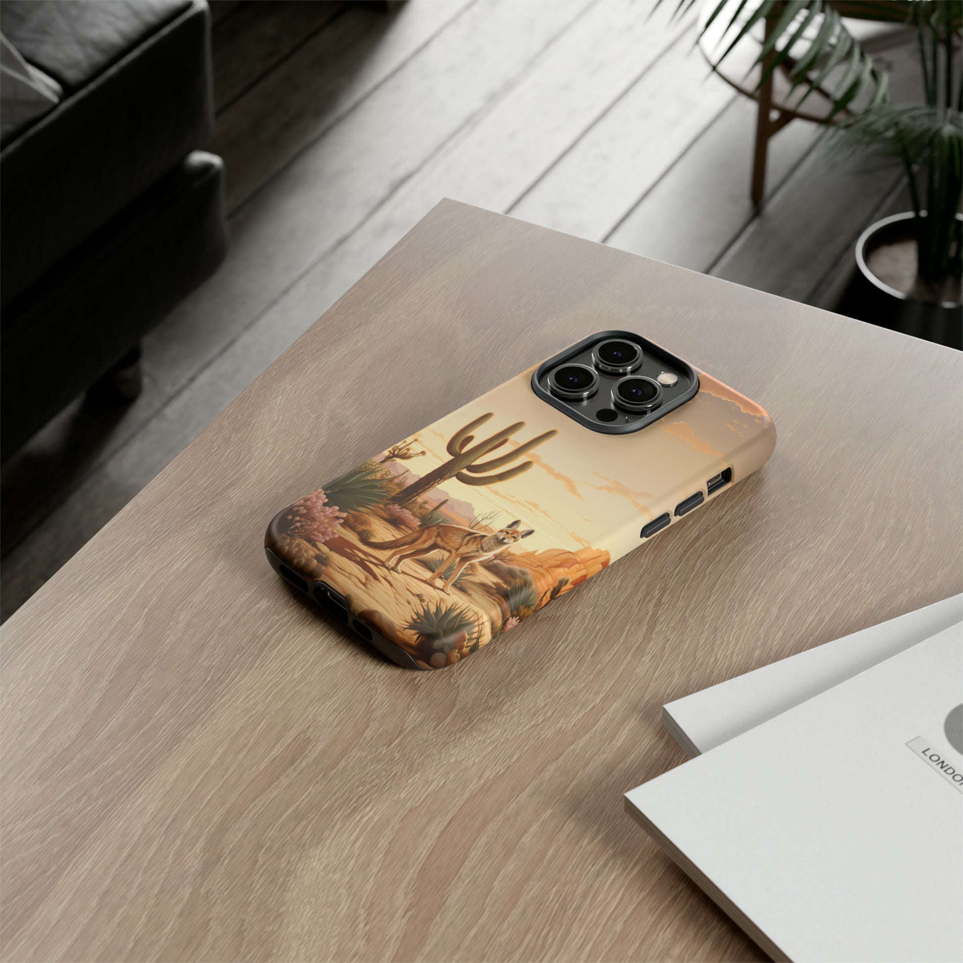 Unveiling our Western Tough Cell Phone Case: Dusk Jackal Oasis Edition! Witness the beauty of dusk with a jackal in a desert landscape next to a cactus. This design offers both rugged protection and a touch of twilight elegance.