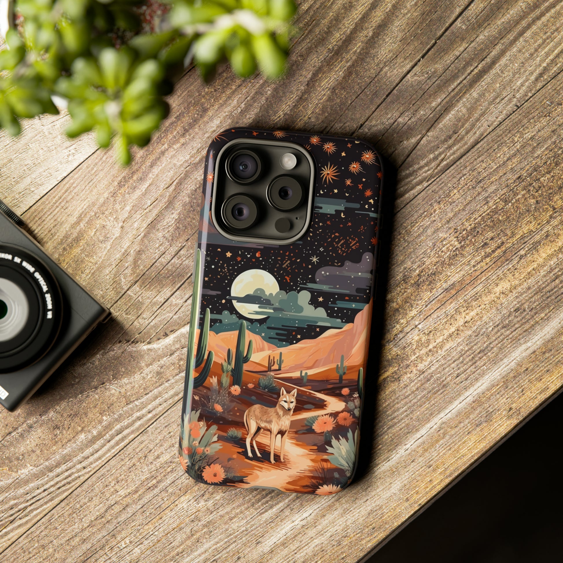 Unveiling our Tough Western Cell Phone Case: Stellar Desert Jackal Edition! Embrace the beauty of the night with a jackal in a desert landscape, under a starry sky, surrounded by cacti. This case provides rugged protection with a touch of celestial elegance.