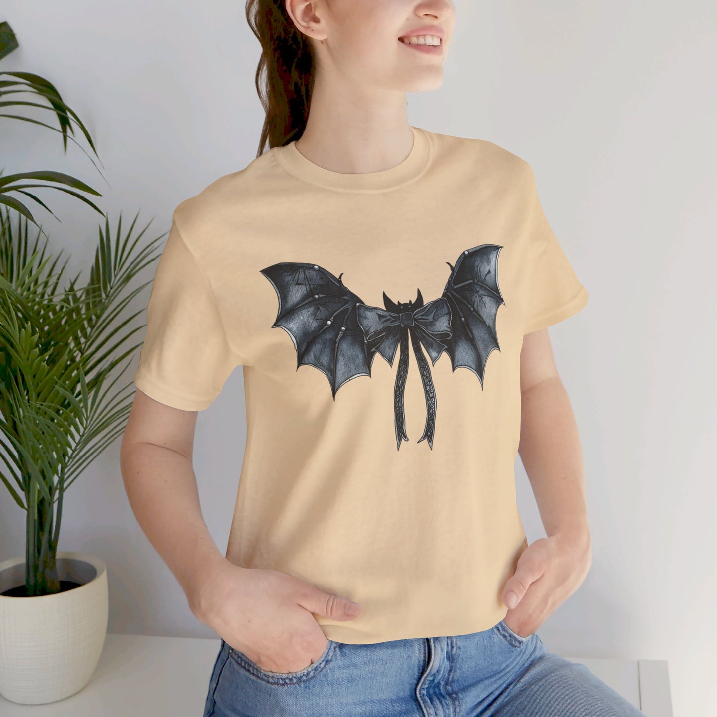 Subtle Spooks: Halloween Bella Canvas T-shirt with Minimalistic Bat Wing Design