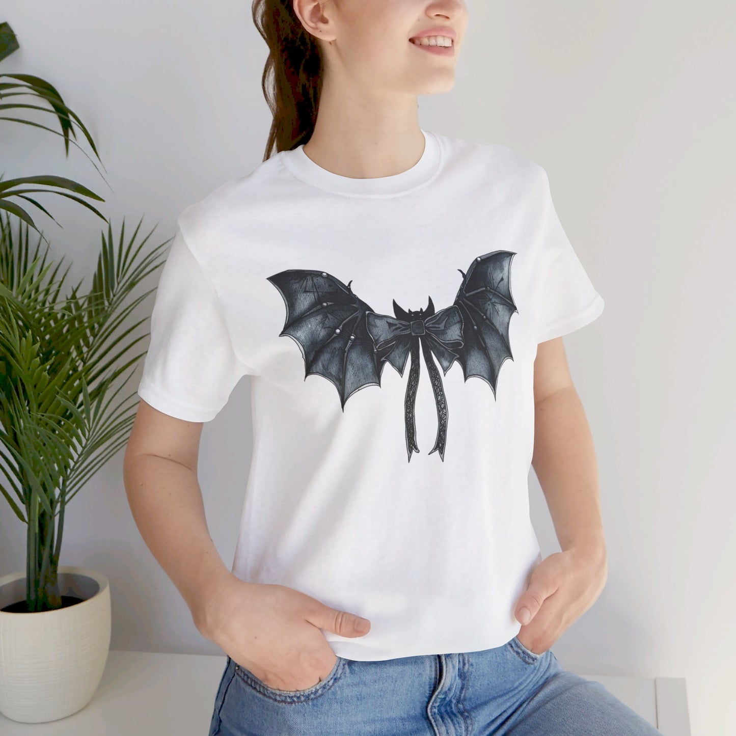 Subtle Spooks: Halloween Bella Canvas T-shirt with Minimalistic Bat Wing Design