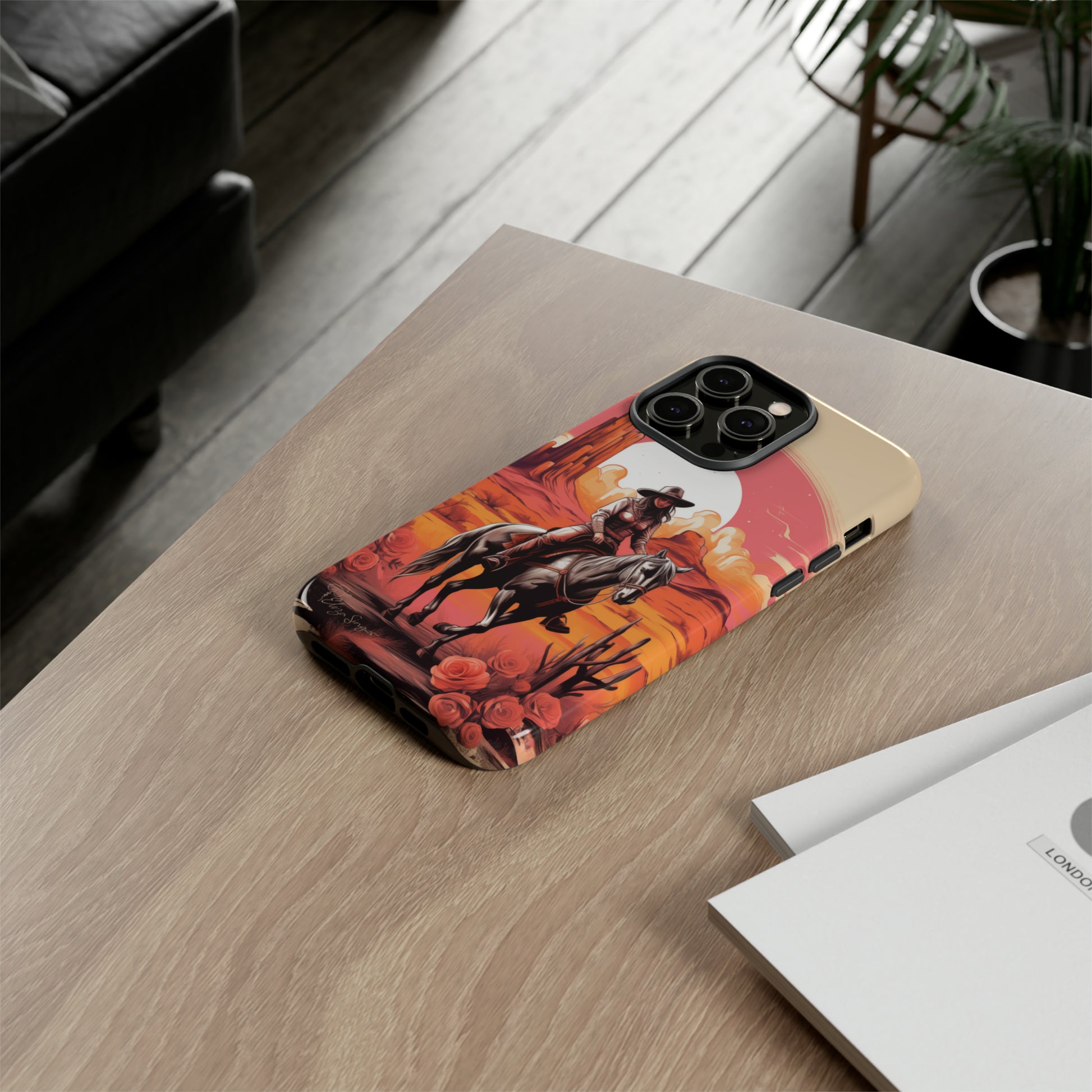 Feminine Adventure Unleashed: Introducing our Tough Western Cell Phone Case, adorned with a stunning design of a cowgirl riding a horse through the desert, surrounded by shades of coral. This unique edition seamlessly combines rugged protection with a touch of feminine flair. Elevate your style with a dash of adventurous charm. #ElizaSinger #PhoneCase #FeminineAdventure 