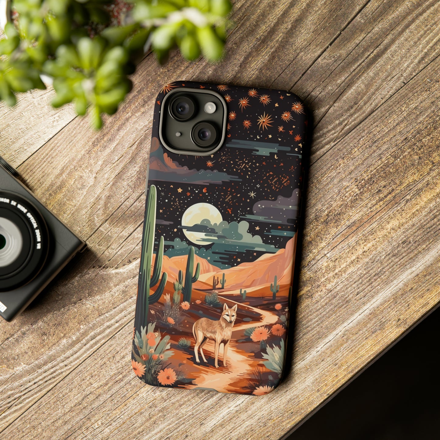 Introducing our Tough Western Cell Phone Case: Twilight Desert Jackal Remix Edition! A variation of our popular design, this edition features a jackal in a desert landscape with a starry night sky and cacti. Get ready for a unique twist on classic rugged protection.