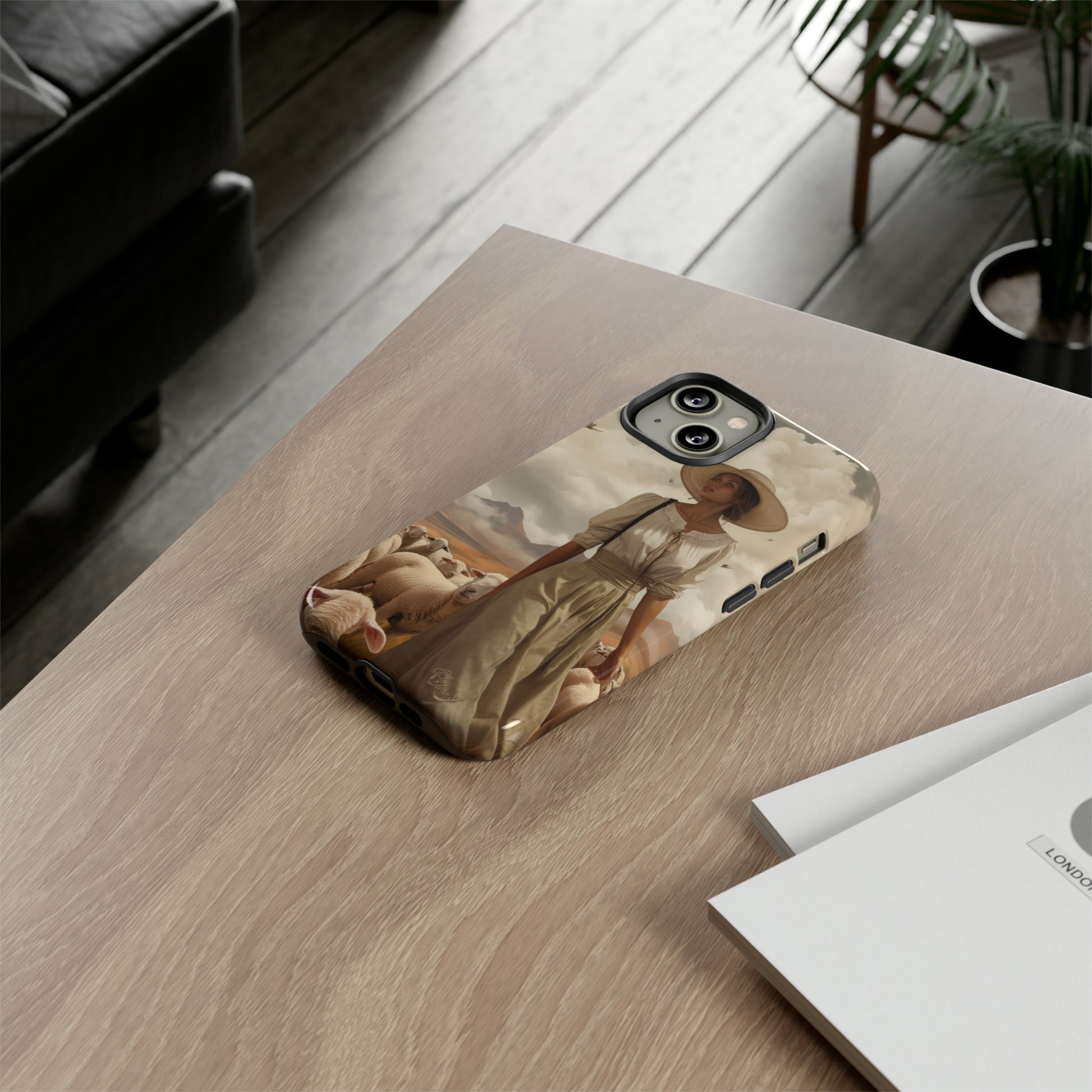 Immerse yourself in a dreamy landscape with our Tough Western Cell Phone Case showcasing a vintage painted design of a woman wearing a hat, walking through a prairie landscape with sheep behind her. Experience the magic of the past with this edition.