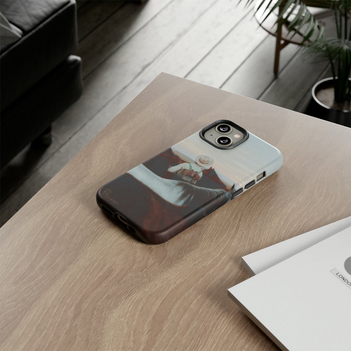 Ride into the Wild: Horse Art Western Photo Yellowstone Design iPhone Tough Protective Cover. Featuring a Cowboy amidst Mountains and Buckskin hues. Compatible with iPhone 15, 14, 13, XS, XR Pro/Max/Mini/P/Plus. Embrace the Spirit of the West with Style and Durability. #ElizaSinger #PhoneCase #WesternDesign
