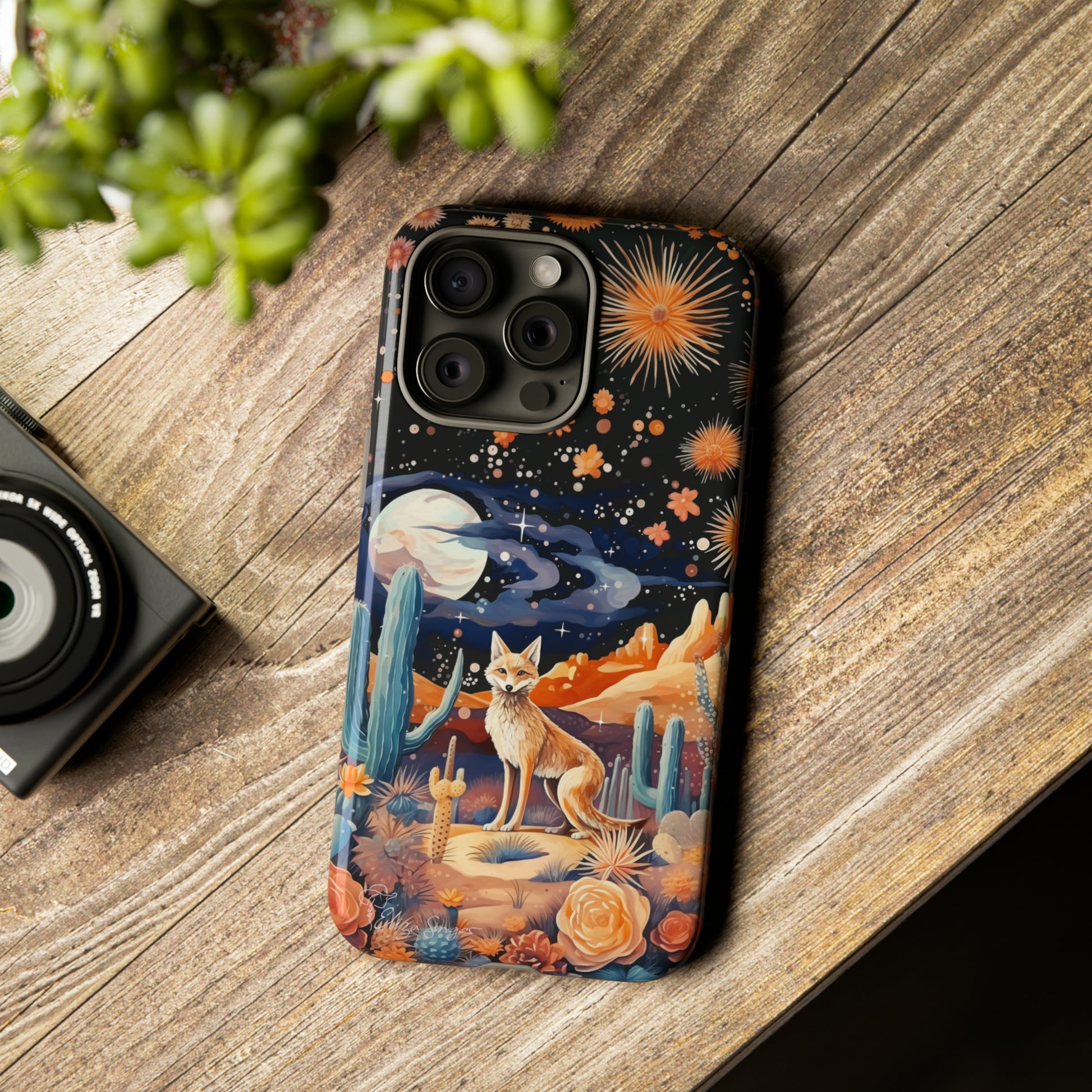 Introducing our Tough Western Cell Phone Case: Midnight Mirage Jackal Edition! Dive into the mysterious desert night with a striking depiction of a jackal, cacti, and a starry sky. This design offers the ideal combination of durability and desert charm.