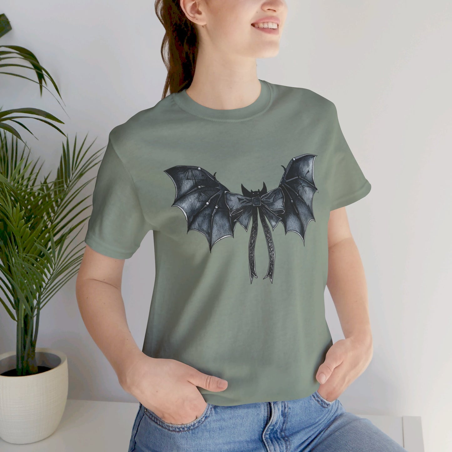 Subtle Spooks: Halloween Bella Canvas T-shirt with Minimalistic Bat Wing Design