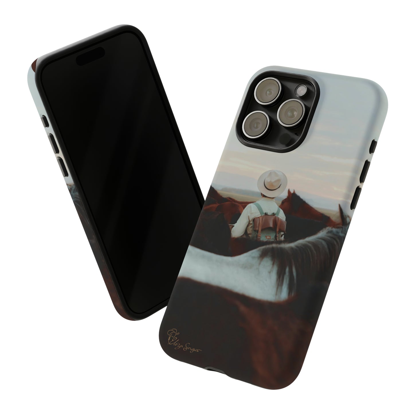 Ride into the Wild: Horse Art Western Photo Yellowstone Design iPhone Tough Protective Cover. Featuring a Cowboy amidst Mountains and Buckskin hues. Compatible with iPhone 15, 14, 13, XS, XR Pro/Max/Mini/P/Plus. Embrace the Spirit of the West with Style and Durability. #ElizaSinger #PhoneCase #WesternDesign