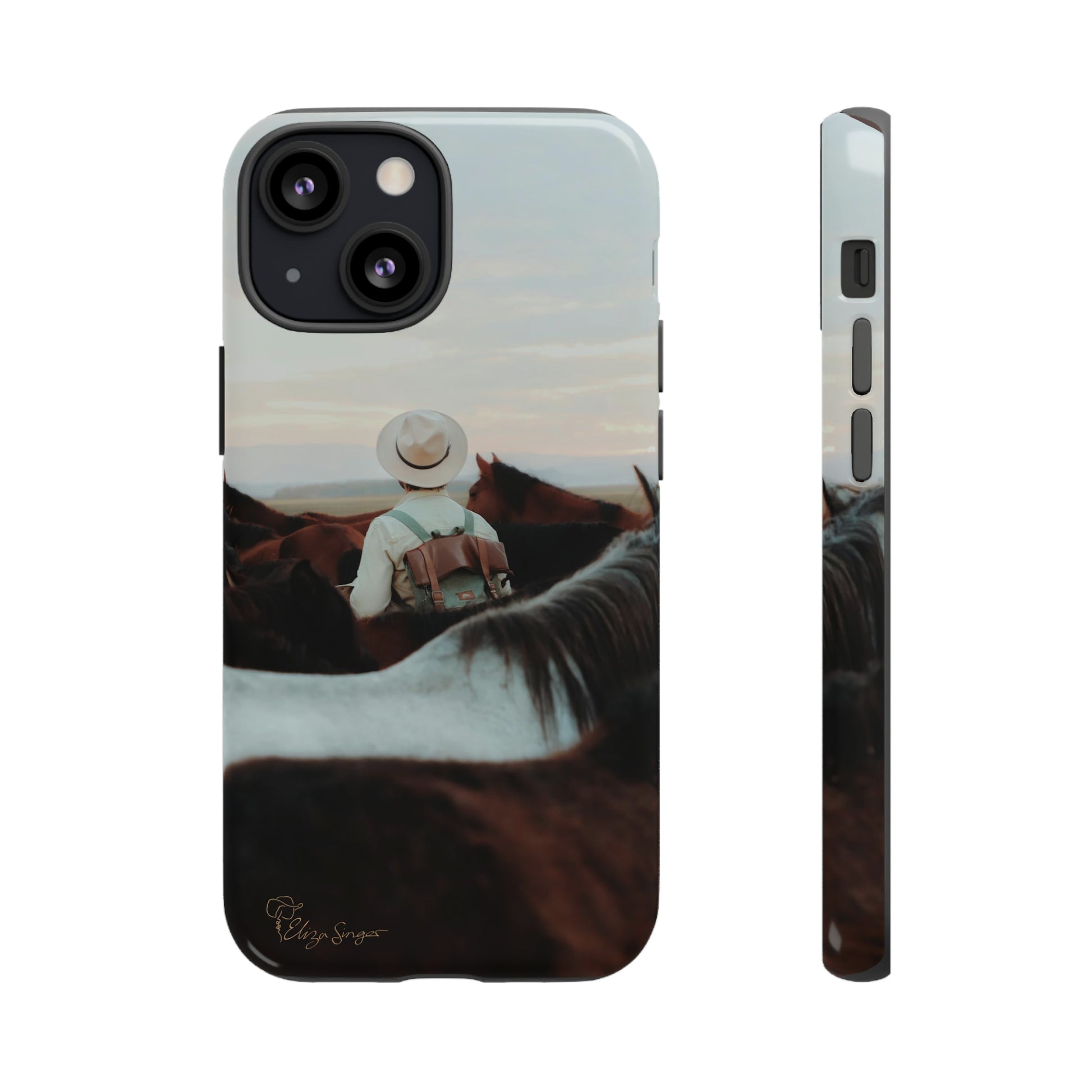 Ride into the Wild: Horse Art Western Photo Yellowstone Design iPhone Tough Protective Cover. Featuring a Cowboy amidst Mountains and Buckskin hues. Compatible with iPhone 15, 14, 13, XS, XR Pro/Max/Mini/P/Plus. Embrace the Spirit of the West with Style and Durability. #ElizaSinger #PhoneCase #WesternDesign