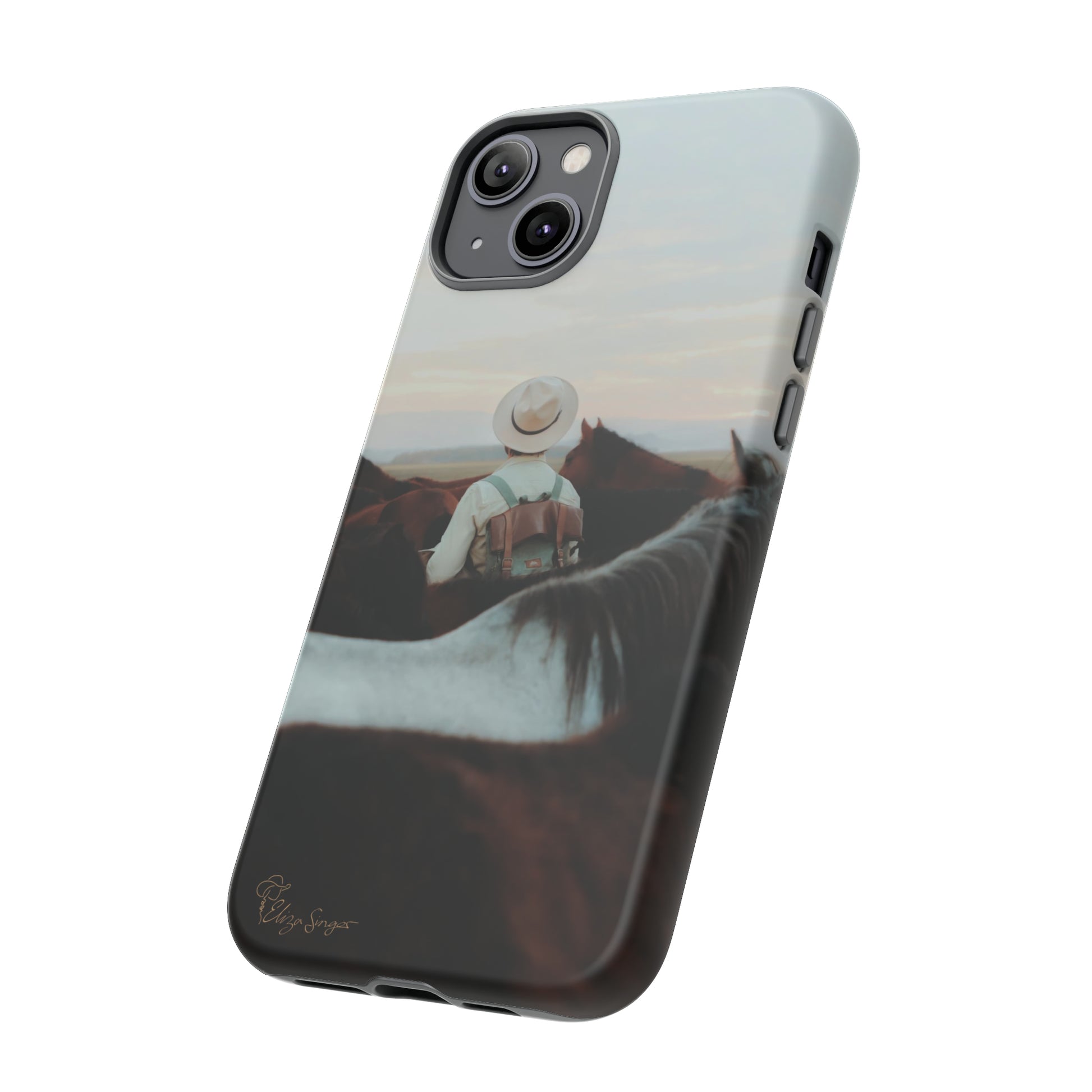 Ride into the Wild: Horse Art Western Photo Yellowstone Design iPhone Tough Protective Cover. Featuring a Cowboy amidst Mountains and Buckskin hues. Compatible with iPhone 15, 14, 13, XS, XR Pro/Max/Mini/P/Plus. Embrace the Spirit of the West with Style and Durability. #ElizaSinger #PhoneCase #WesternDesign