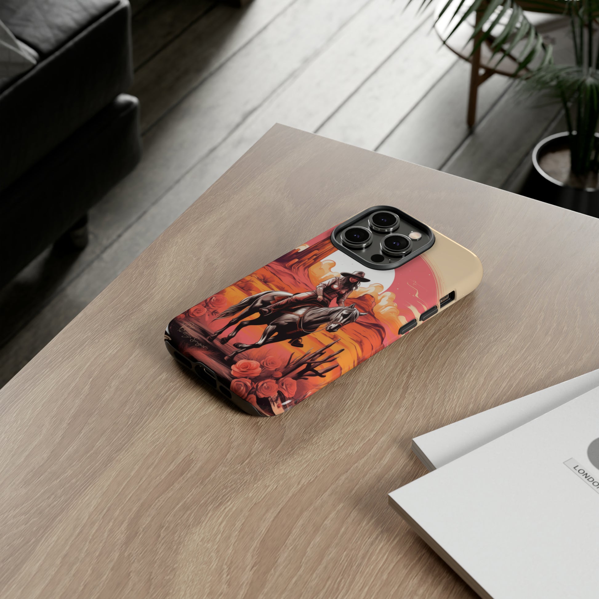Feminine Adventure Unleashed: Introducing our Tough Western Cell Phone Case, adorned with a stunning design of a cowgirl riding a horse through the desert, surrounded by shades of coral. This unique edition seamlessly combines rugged protection with a touch of feminine flair. Elevate your style with a dash of adventurous charm. #ElizaSinger #PhoneCase #FeminineAdventure 