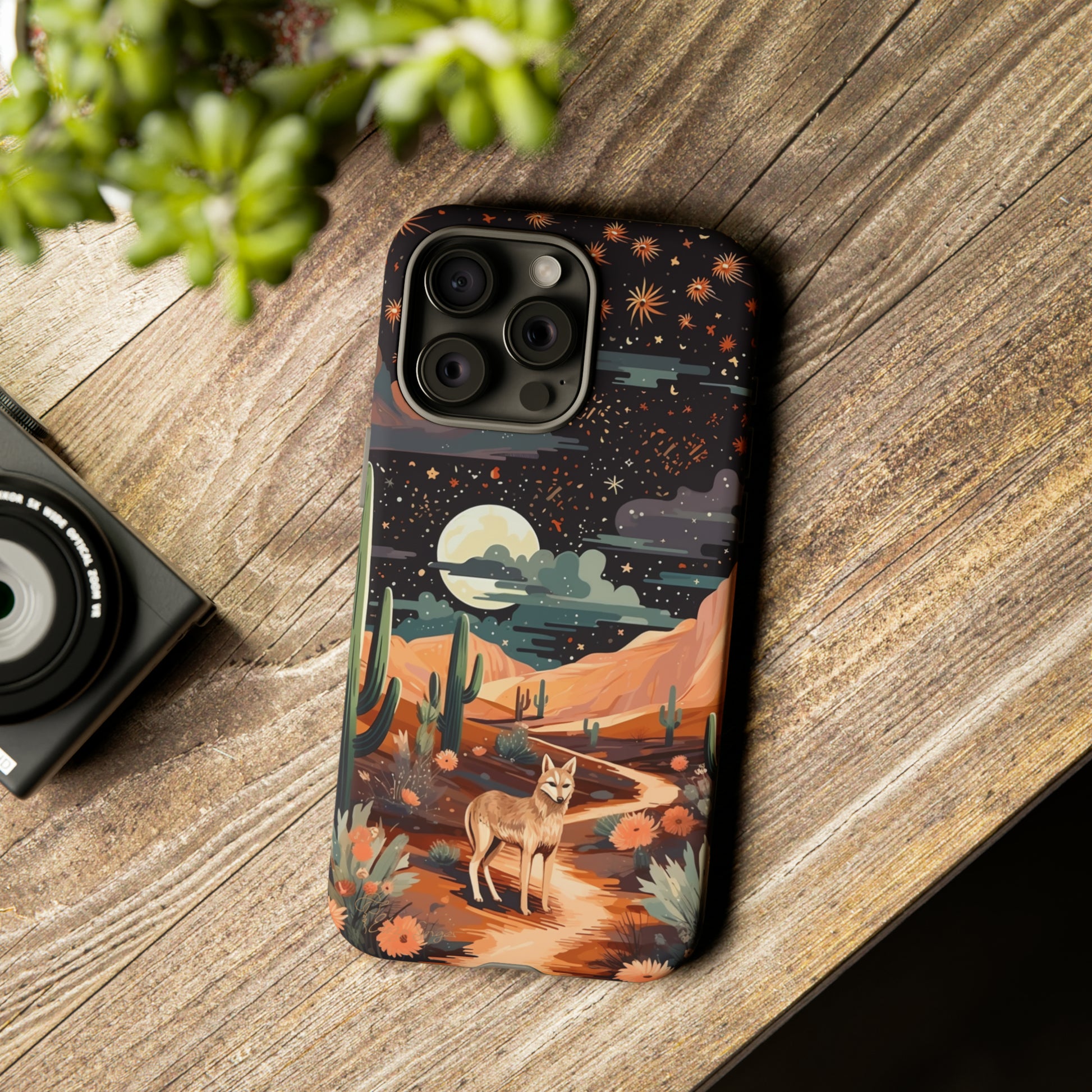 Unveiling our Tough Western Cell Phone Case: Stellar Desert Jackal Edition! Embrace the beauty of the night with a jackal in a desert landscape, under a starry sky, surrounded by cacti. This case provides rugged protection with a touch of celestial elegance.