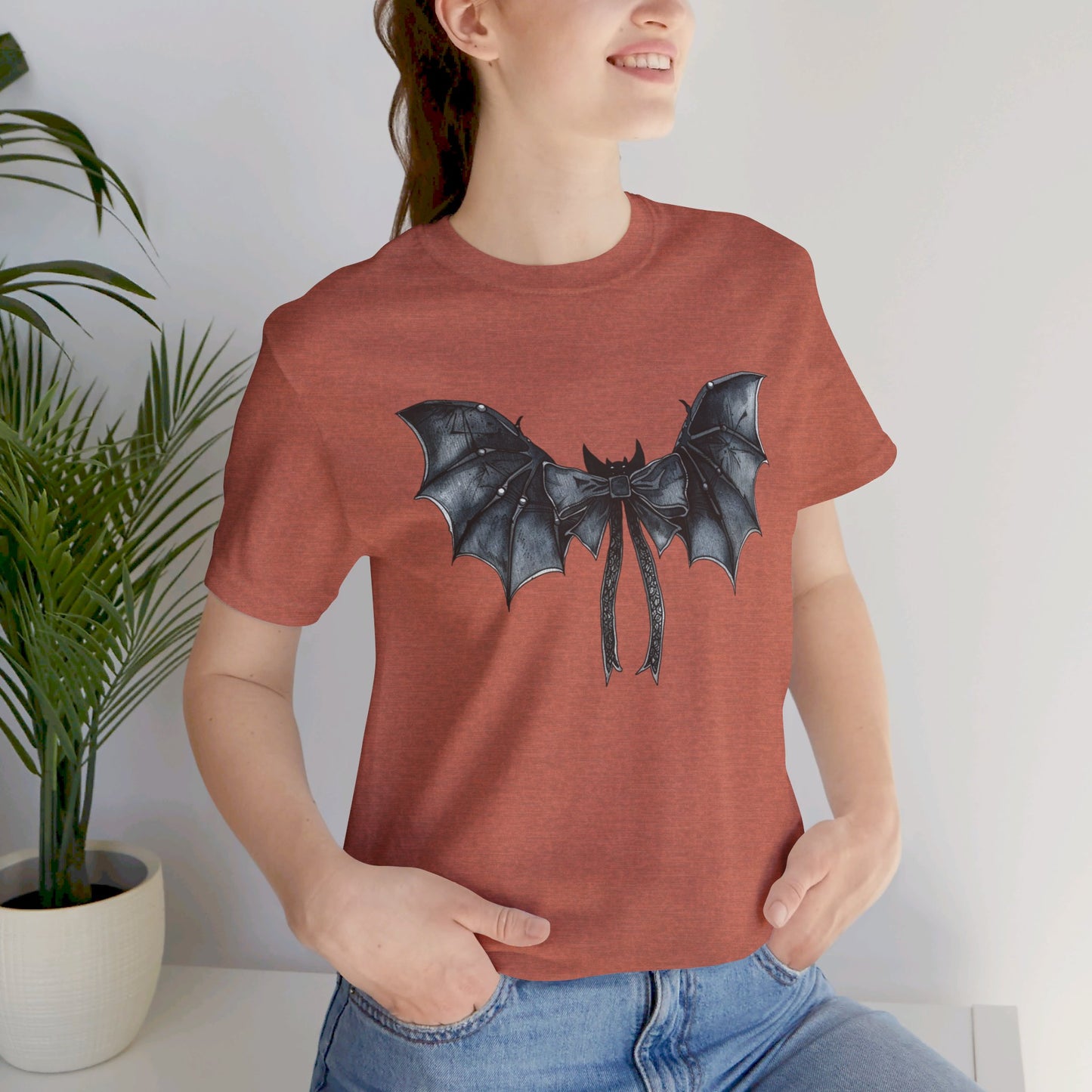 Subtle Spooks: Halloween Bella Canvas T-shirt with Minimalistic Bat Wing Design