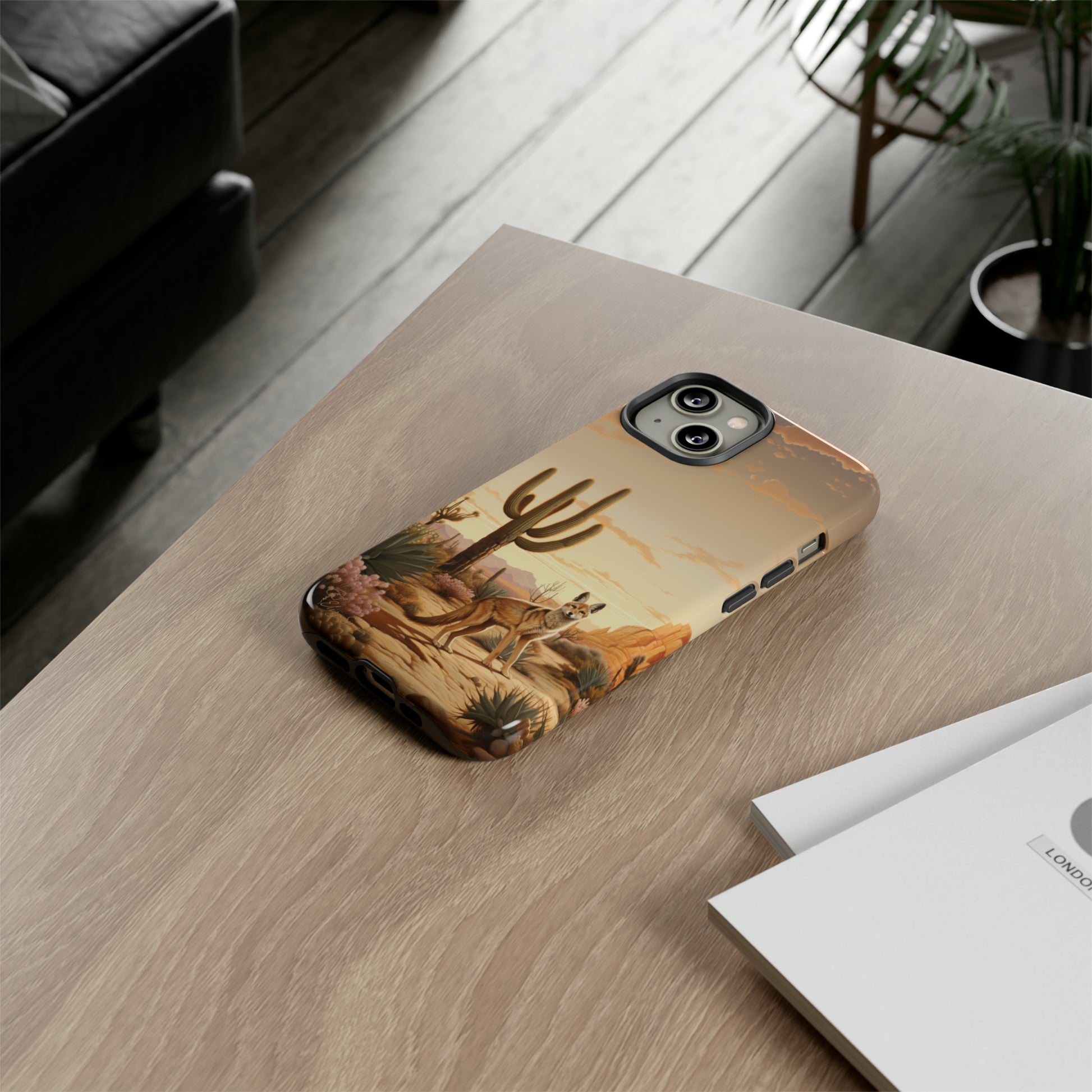 Unveiling our Western Tough Cell Phone Case: Dusk Jackal Oasis Edition! Witness the beauty of dusk with a jackal in a desert landscape next to a cactus. This design offers both rugged protection and a touch of twilight elegance.
