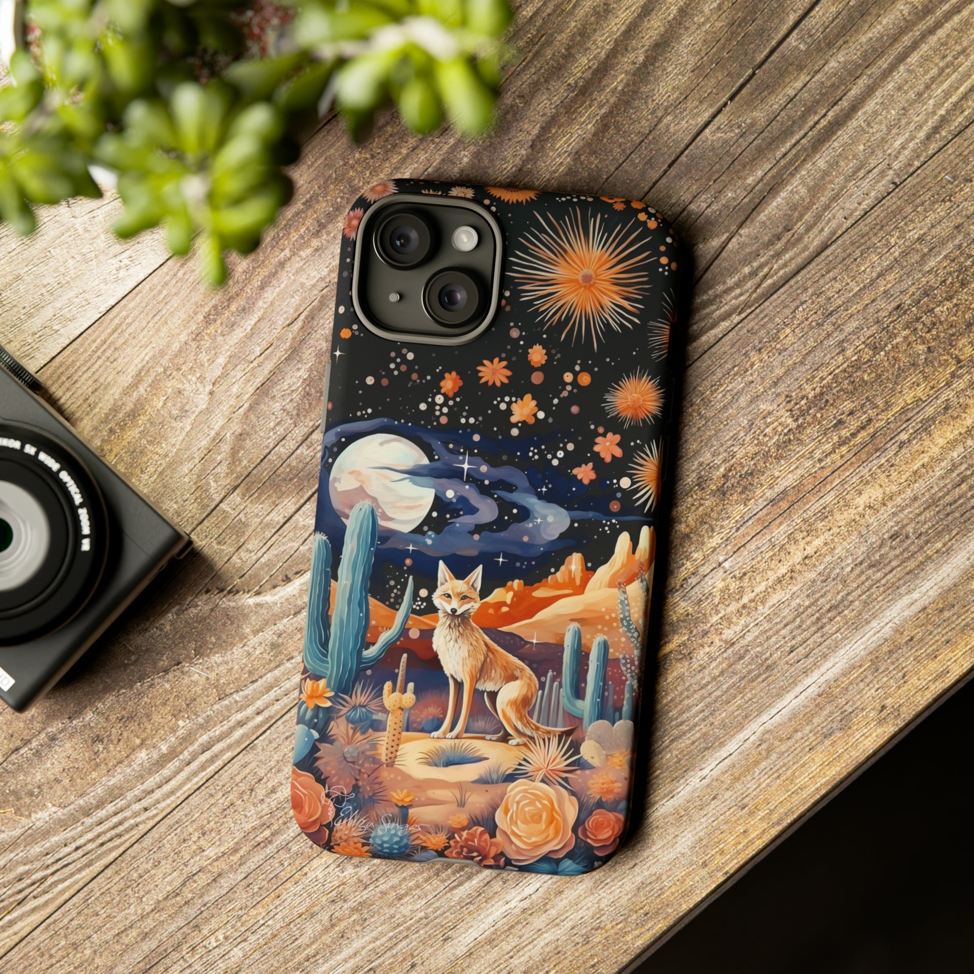 Introducing our Tough Western Cell Phone Case: Midnight Mirage Jackal Edition! Dive into the mysterious desert night with a striking depiction of a jackal, cacti, and a starry sky. This design offers the ideal combination of durability and desert charm.