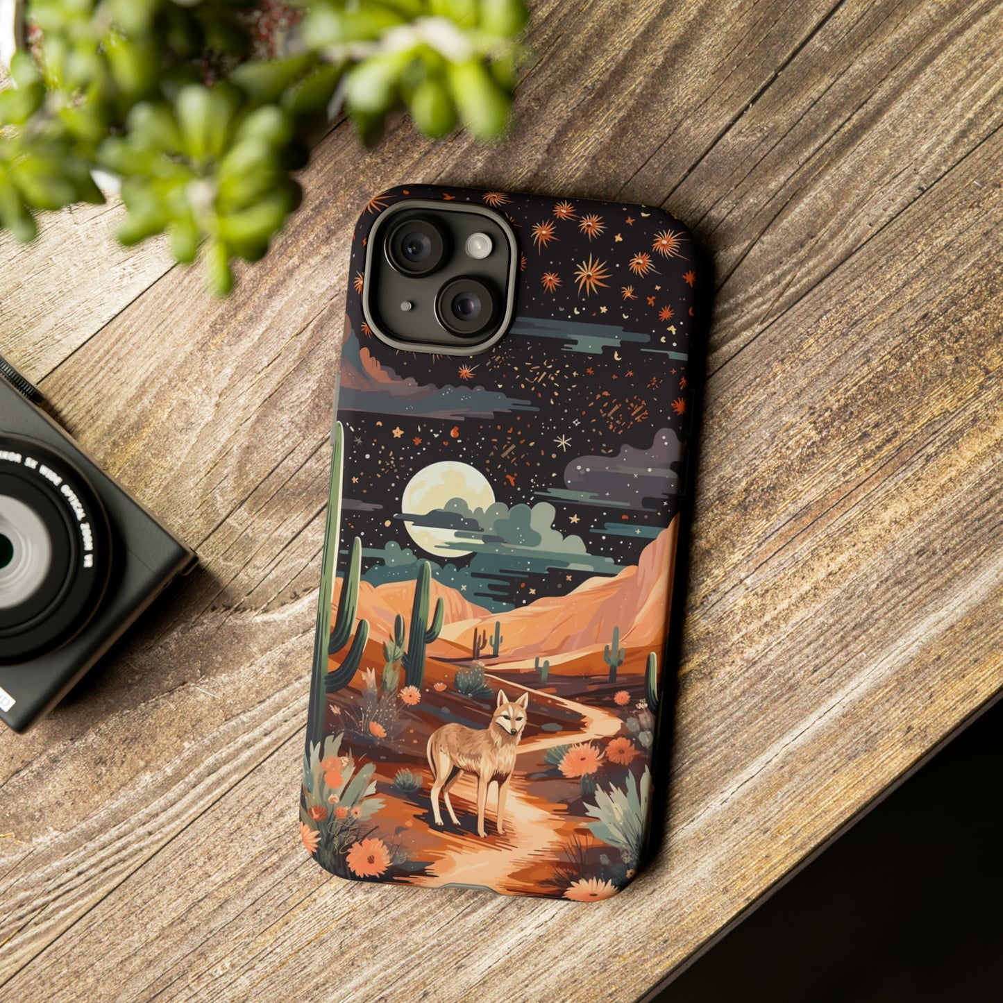 Unveiling our Tough Western Cell Phone Case: Stellar Desert Jackal Edition! Embrace the beauty of the night with a jackal in a desert landscape, under a starry sky, surrounded by cacti. This case provides rugged protection with a touch of celestial elegance.