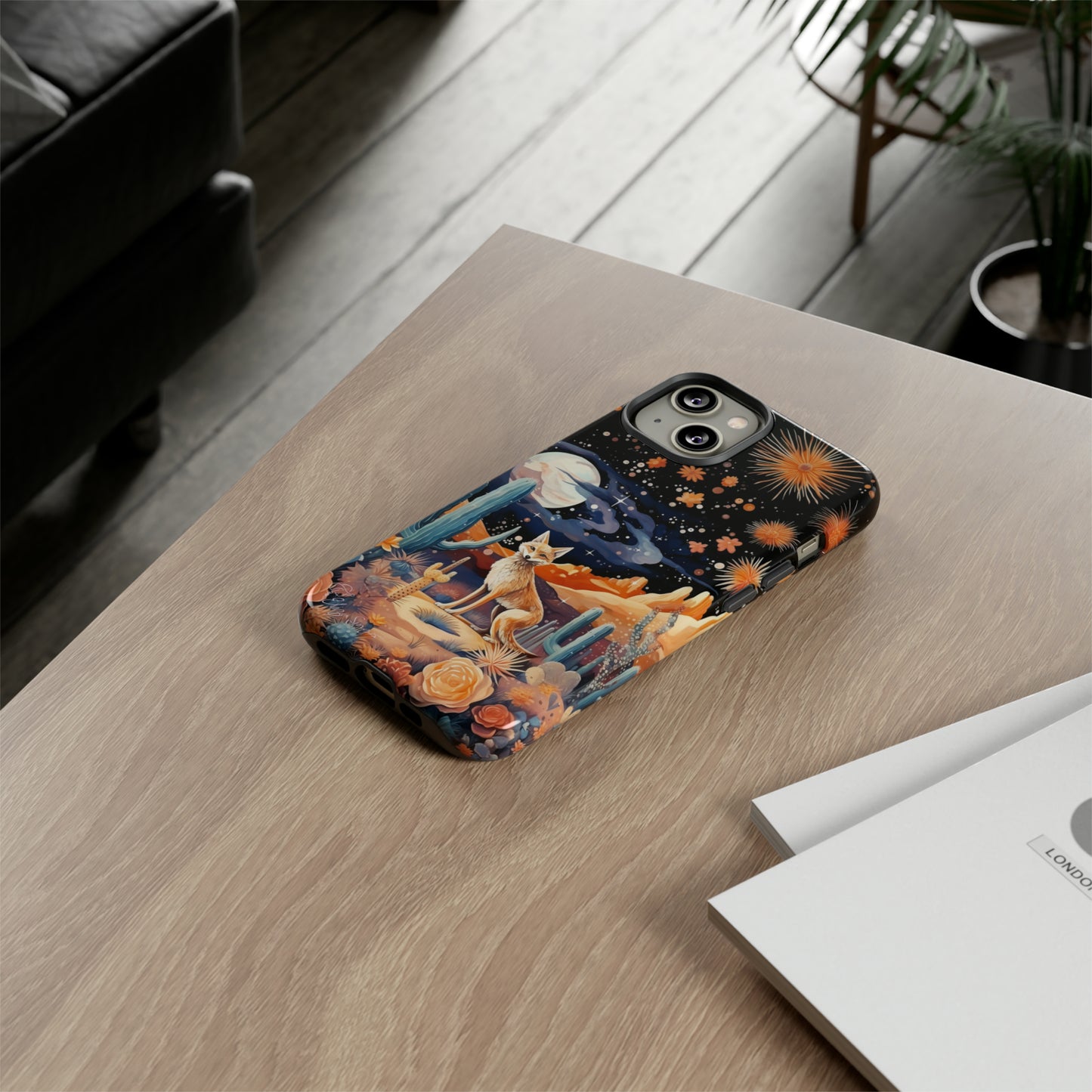 Introducing our Tough Western Cell Phone Case: Midnight Mirage Jackal Edition! Dive into the mysterious desert night with a striking depiction of a jackal, cacti, and a starry sky. This design offers the ideal combination of durability and desert charm.