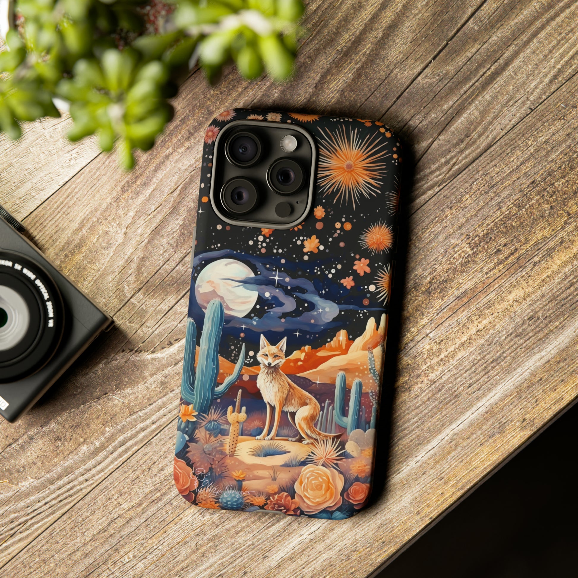 Introducing our Tough Western Cell Phone Case: Midnight Mirage Jackal Edition! Dive into the mysterious desert night with a striking depiction of a jackal, cacti, and a starry sky. This design offers the ideal combination of durability and desert charm.