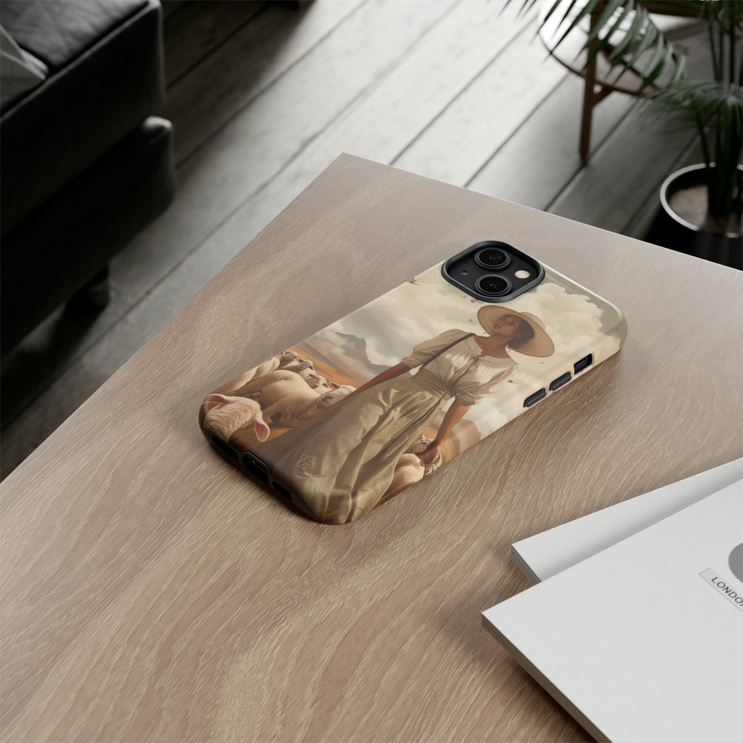 Immerse yourself in a dreamy landscape with our Tough Western Cell Phone Case showcasing a vintage painted design of a woman wearing a hat, walking through a prairie landscape with sheep behind her. Experience the magic of the past with this edition.
