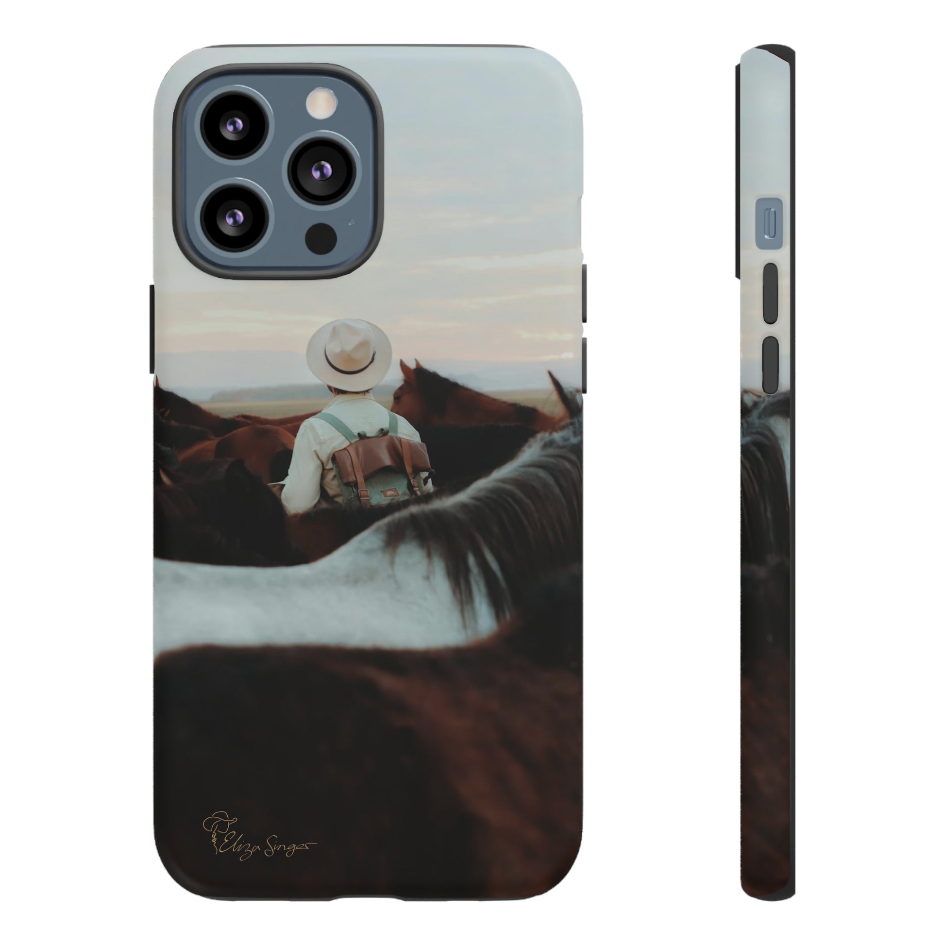 Ride into the Wild: Horse Art Western Photo Yellowstone Design iPhone Tough Protective Cover. Featuring a Cowboy amidst Mountains and Buckskin hues. Compatible with iPhone 15, 14, 13, XS, XR Pro/Max/Mini/P/Plus. Embrace the Spirit of the West with Style and Durability. #ElizaSinger #PhoneCase #WesternDesign