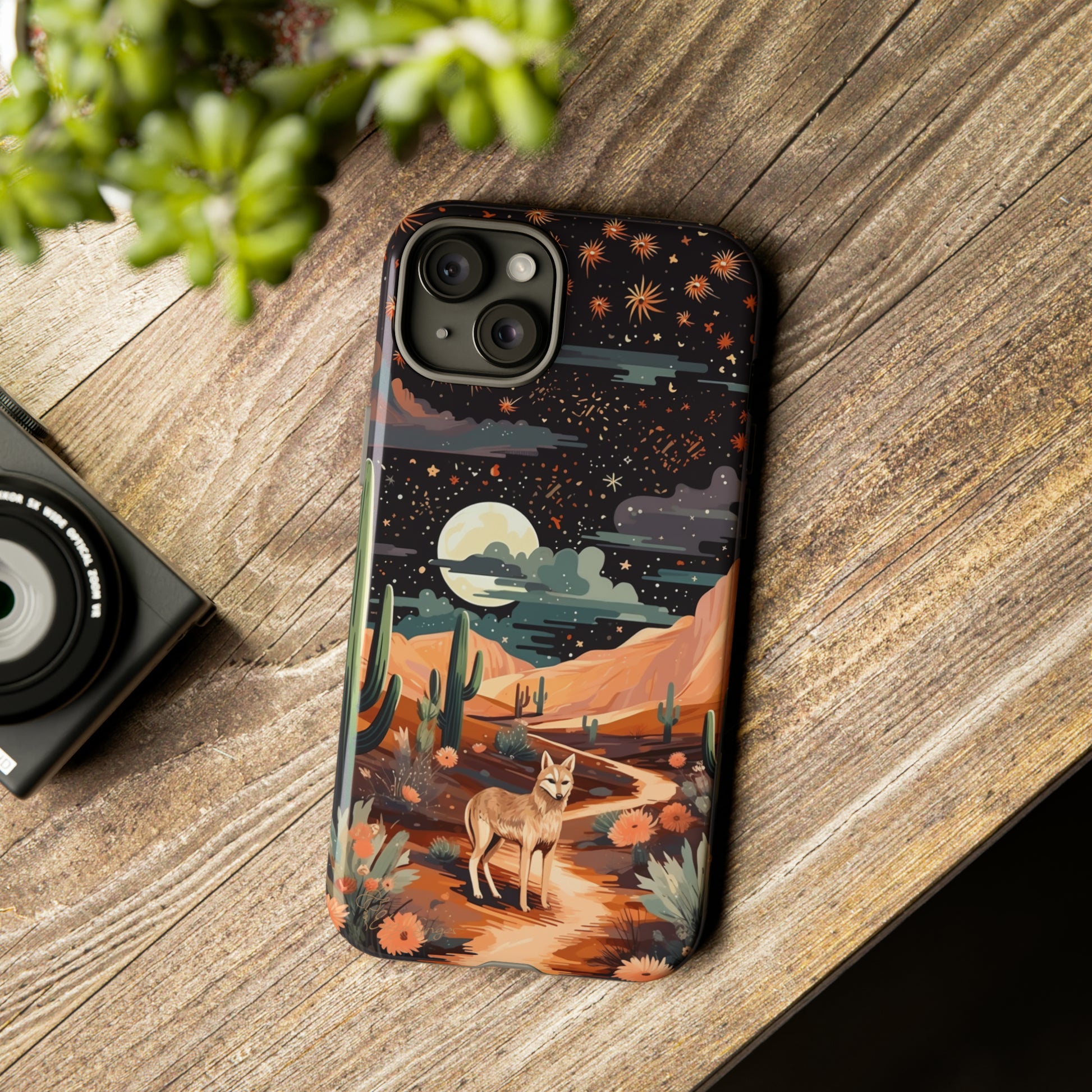 Unveiling our Tough Western Cell Phone Case: Stellar Desert Jackal Edition! Embrace the beauty of the night with a jackal in a desert landscape, under a starry sky, surrounded by cacti. This case provides rugged protection with a touch of celestial elegance.
