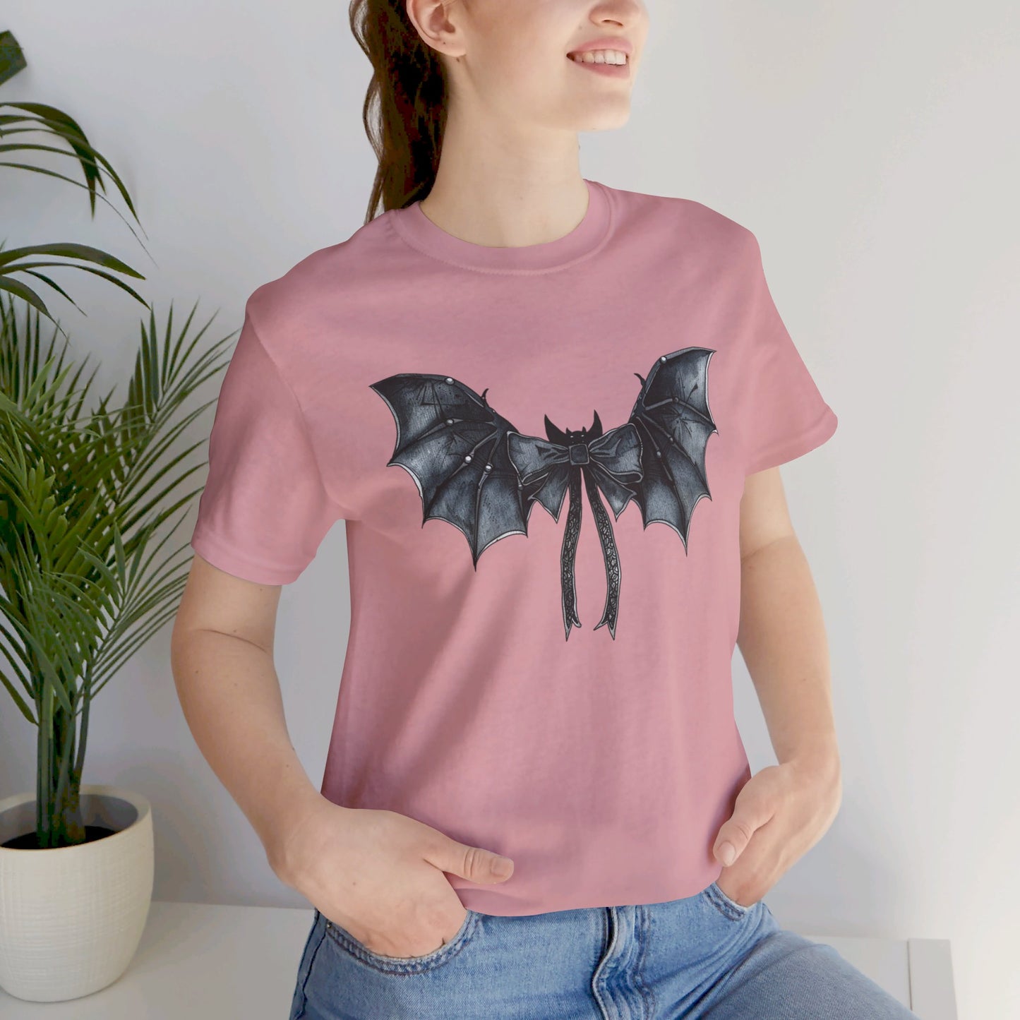 Subtle Spooks: Halloween Bella Canvas T-shirt with Minimalistic Bat Wing Design