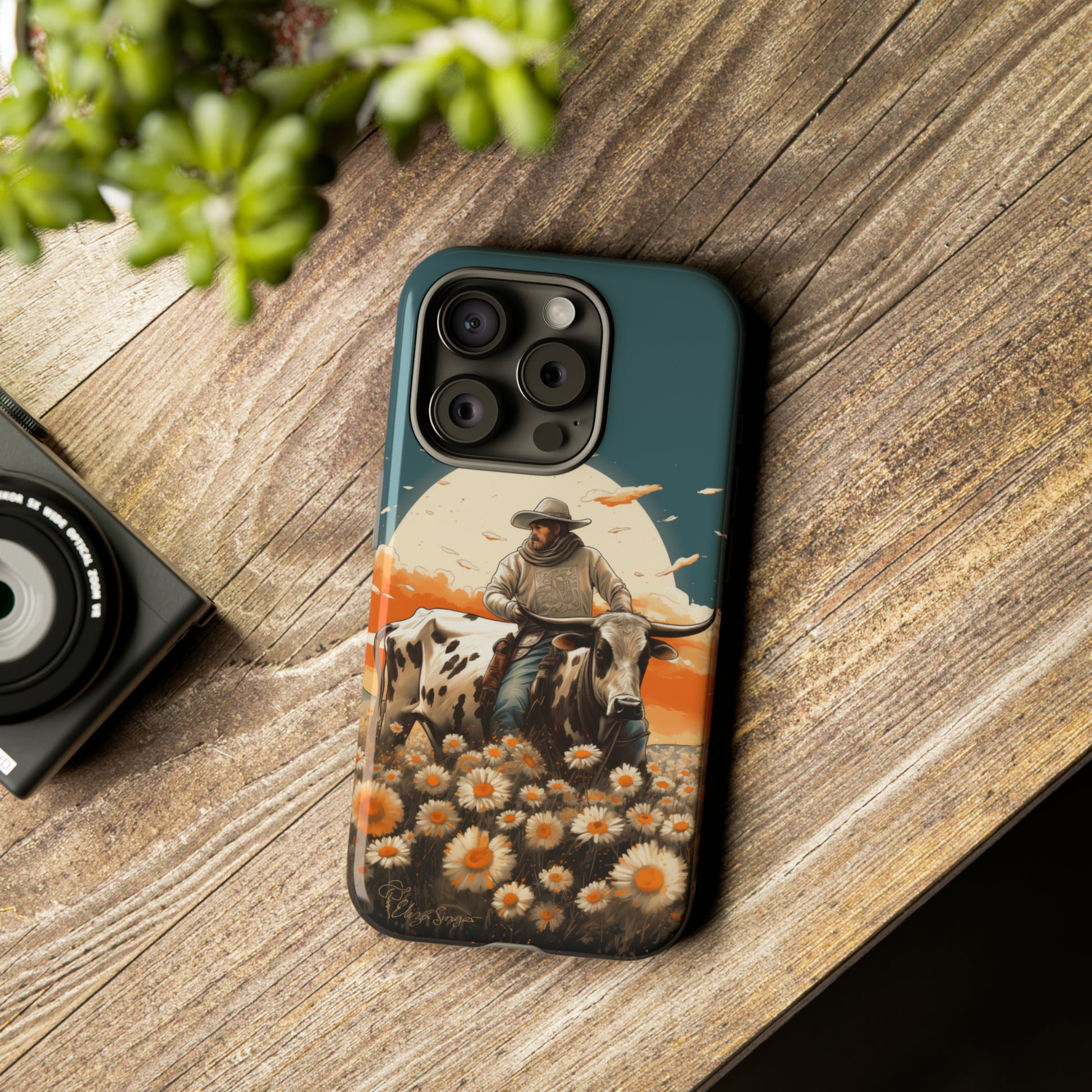Harmony of Contrasts: Dive into our Tough Cell Phone Case, a visual symphony featuring a bullrider on a black and white dairy cow amidst a vibrant field of flowers. This edition effortlessly merges toughness with artistic flair, offering a unique and captivating contrast. Elevate your phone with rugged elegance. #ElizaSinger #PhoneCase #ContrastHarmony