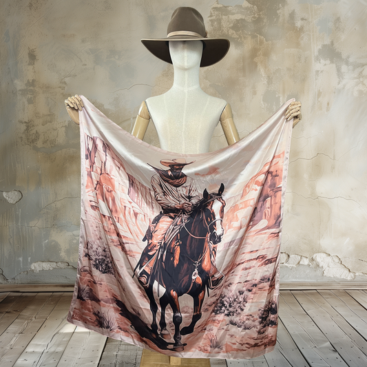 Ride into solitude with Lone Trails Wild Rag. A lone cowboy on horseback traverses a Utah landscape in muted earthy colors on this 39" square of 100% satin silk. Elevate your style with this scenic and timeless accessory.